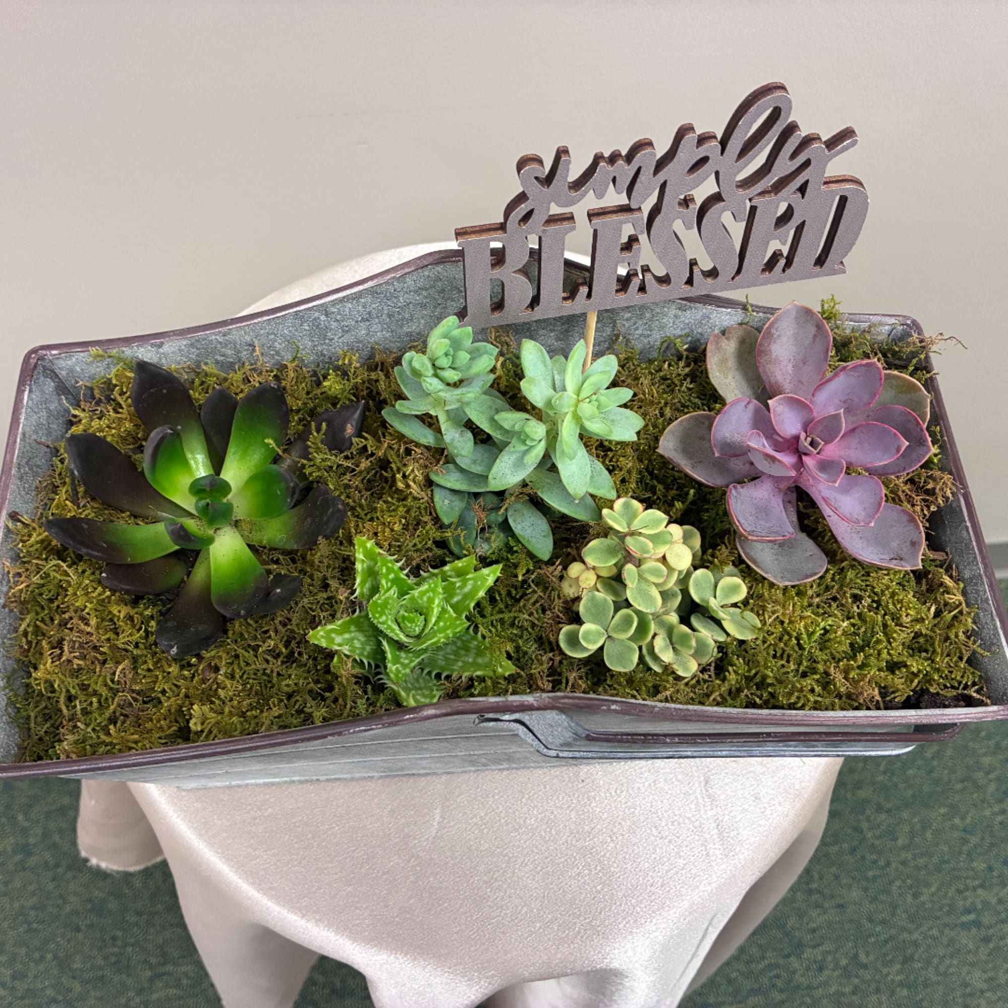 Rectangular planter with assorted succulents and a "simply blessed" sign