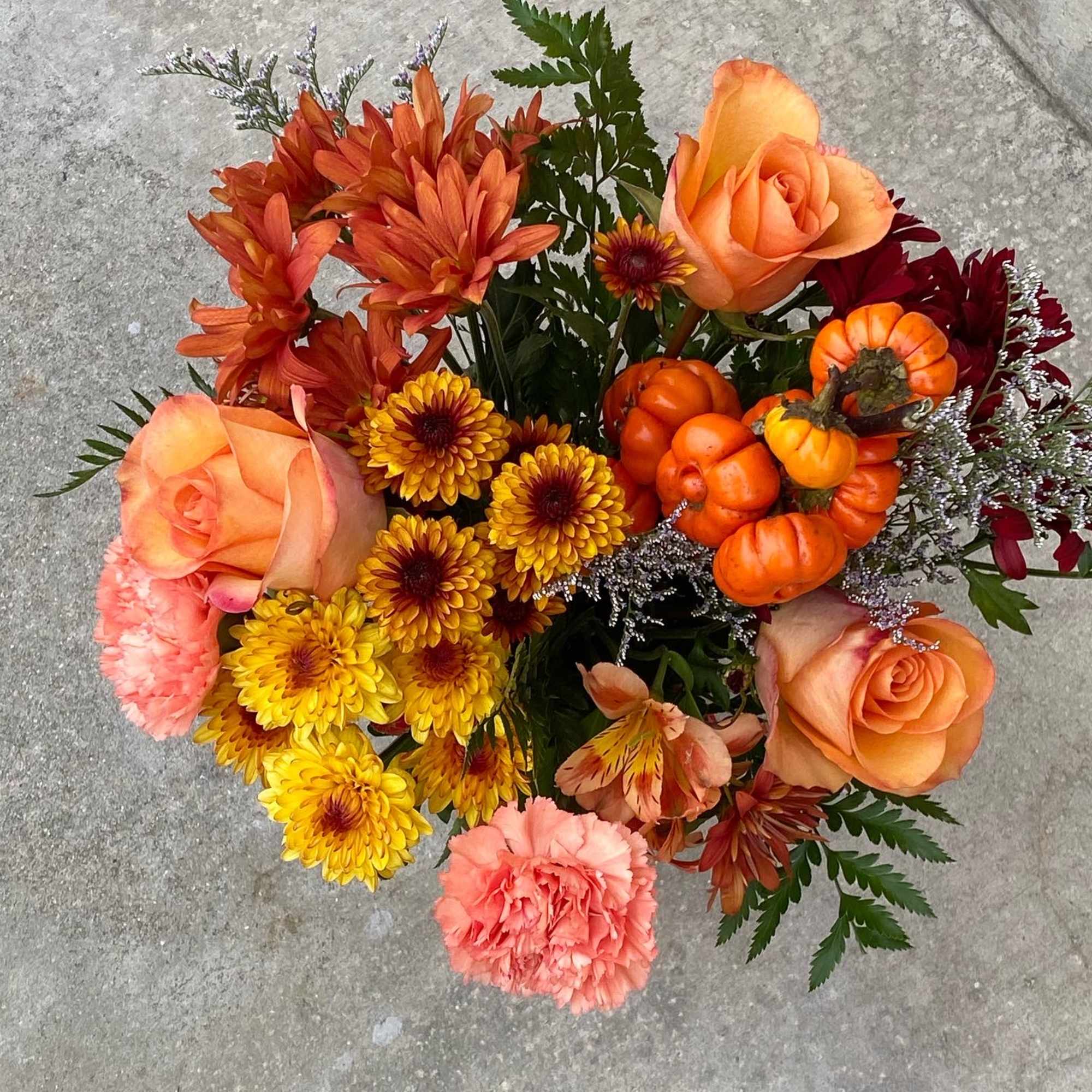 This is a mixed of chrysanthemum, daisy, asltromerias, roses, carnation, and mini, photo 2 of 3