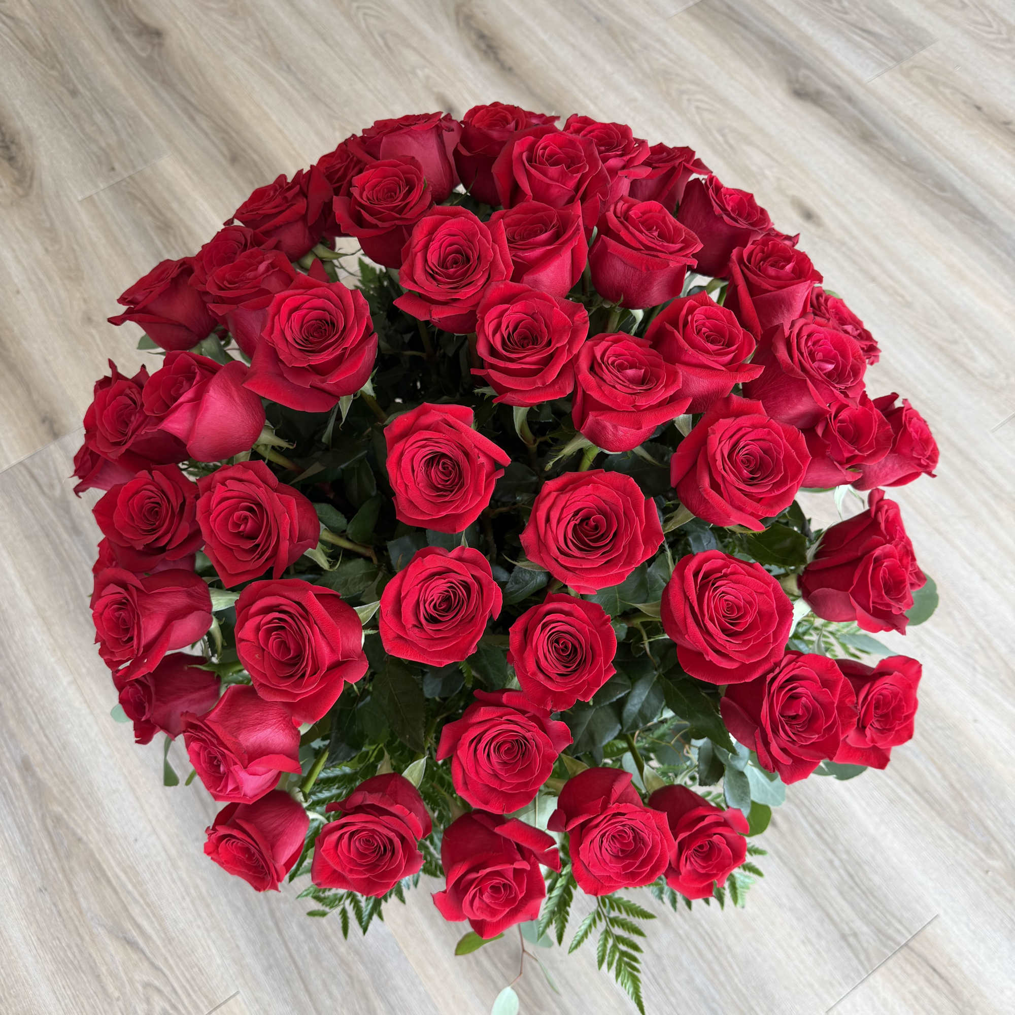 A lush 60ct dome of vivid red roses creates an immediate romantic, photo 2 of 2