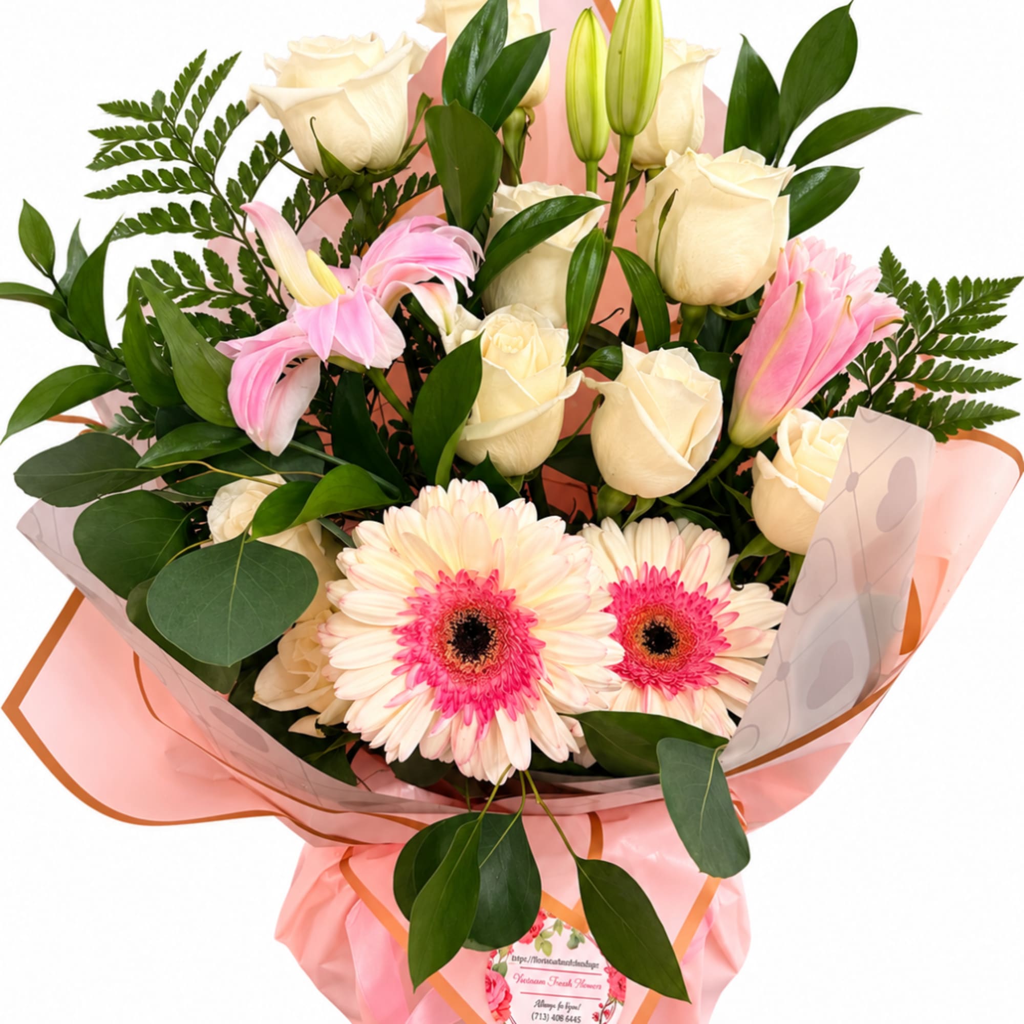 Pink and cream bouquet with roses and gerbera daisies wrapped in pink paper
