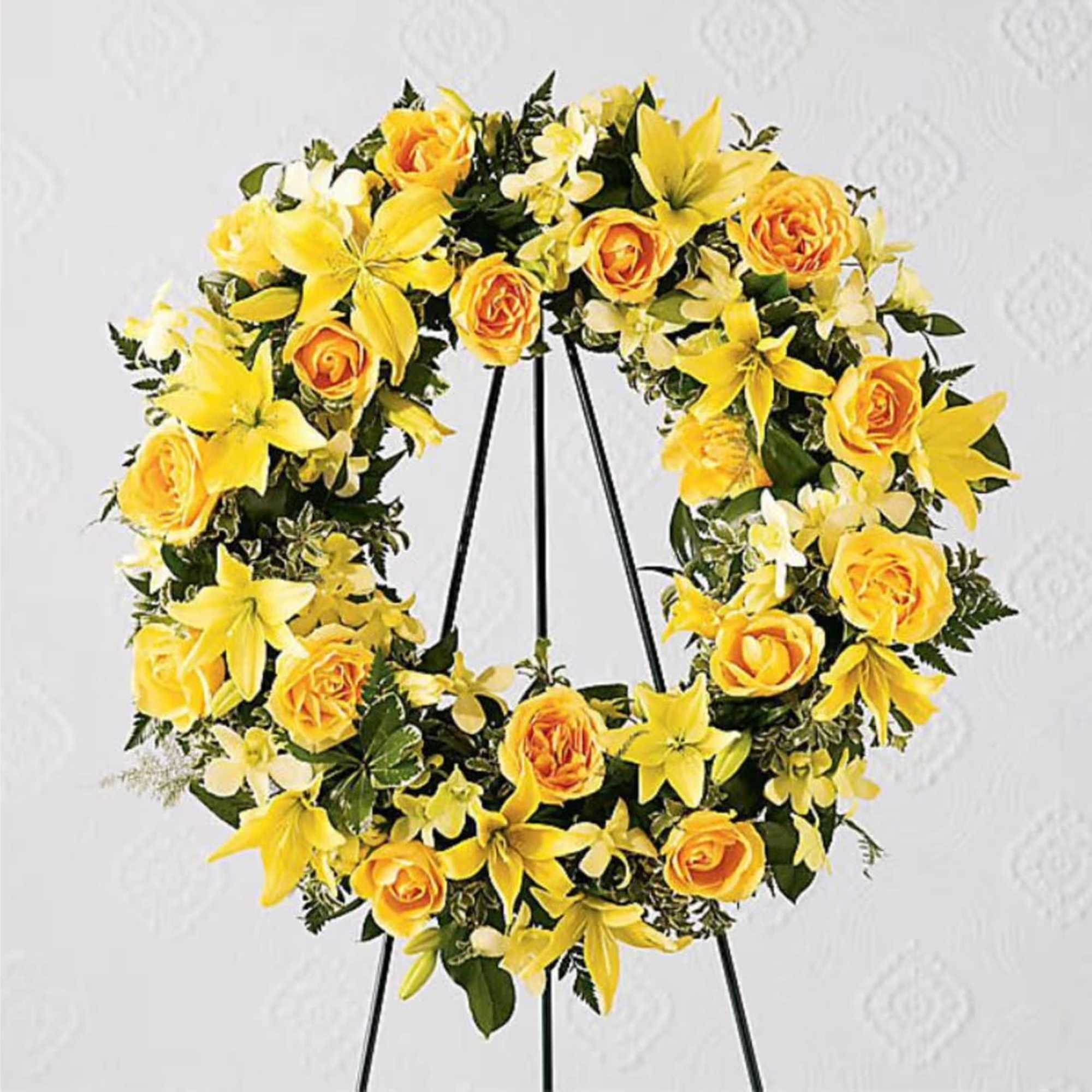 Yellow floral wreath on a black stand