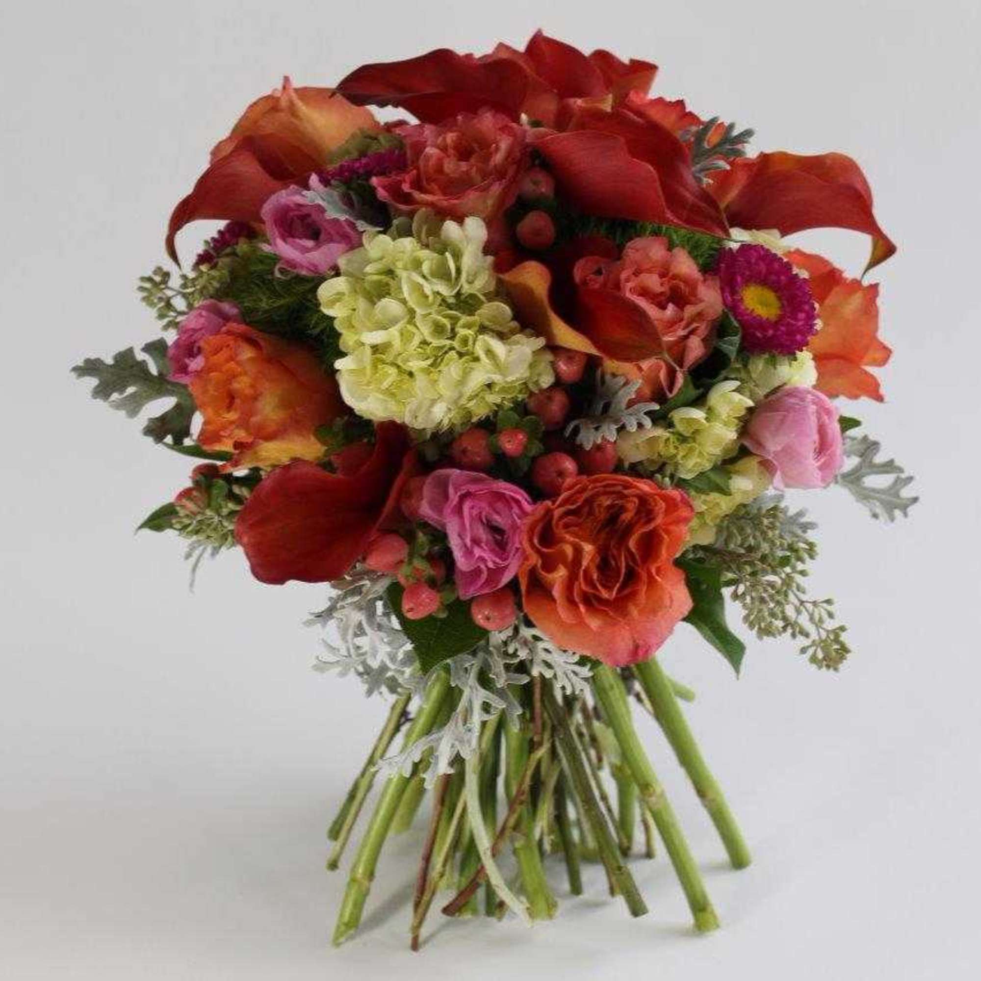 Bouquet of red, orange, pink, and cream flowers