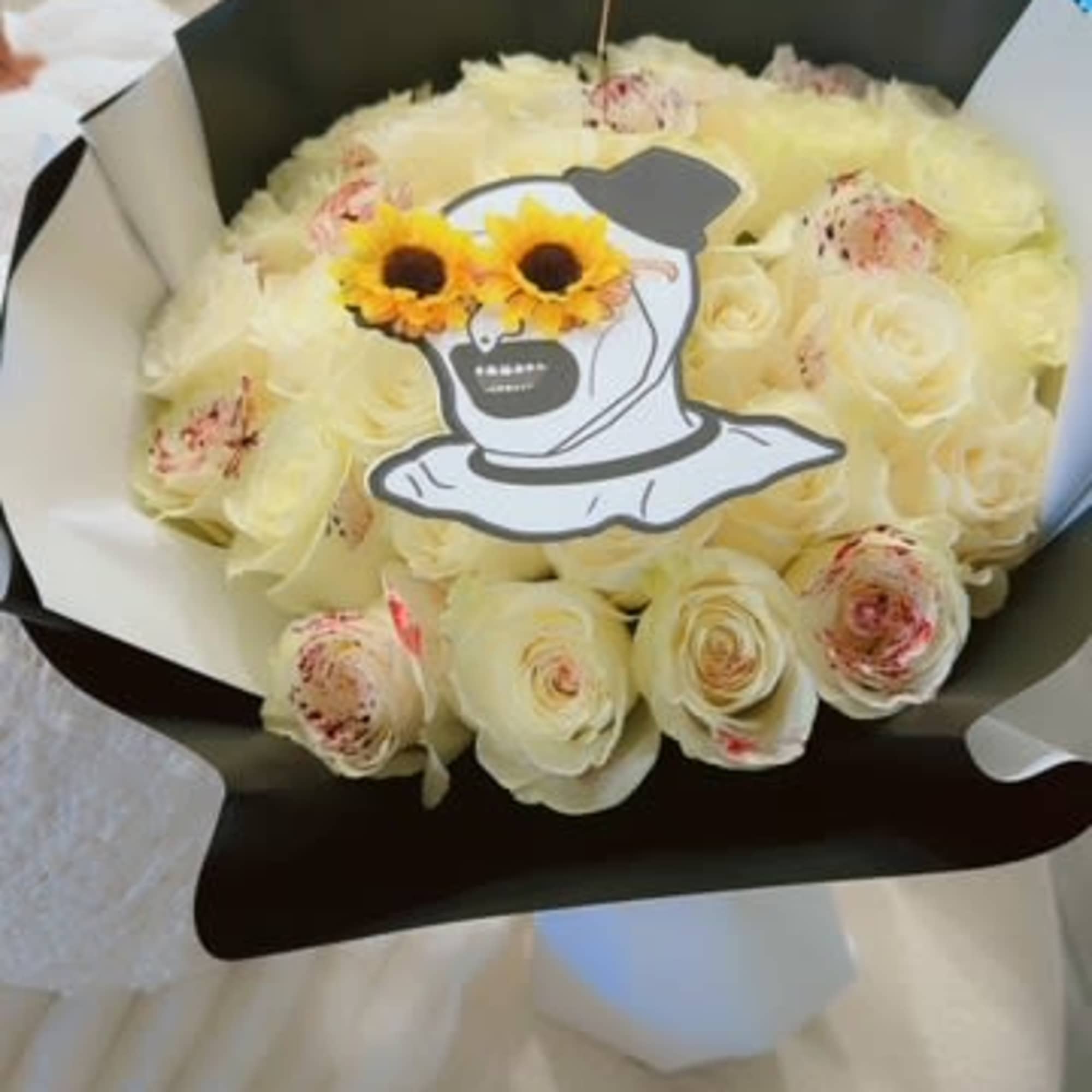 "This exclusive bouquet blends the elegance of white roses with the mysterious, photo 2 of 2