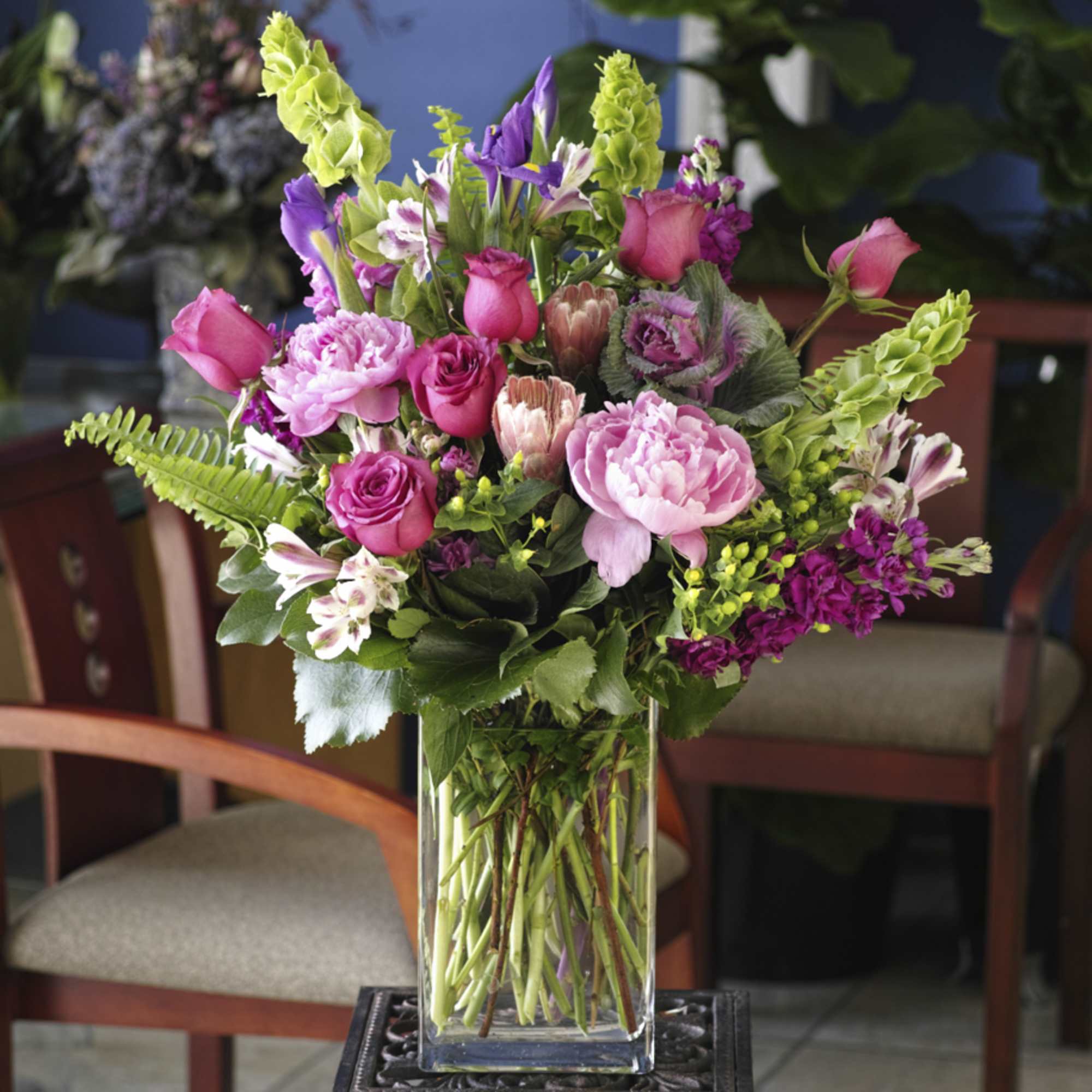Pink and purple mixed bouquet in a clear glass vase, photo 2 of 2