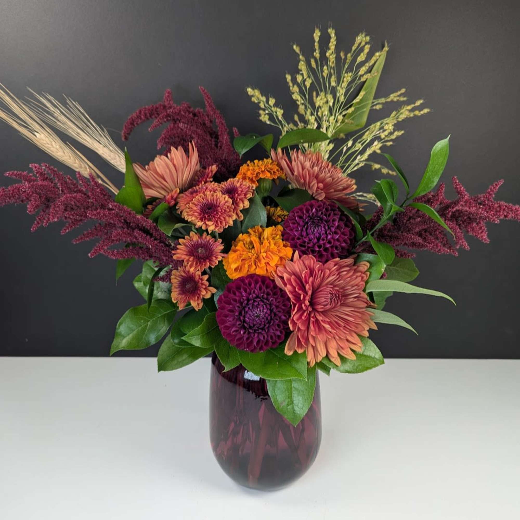 Amber Harvest Arrangement
Embrace the rich, warm hues of autumn with our Amber