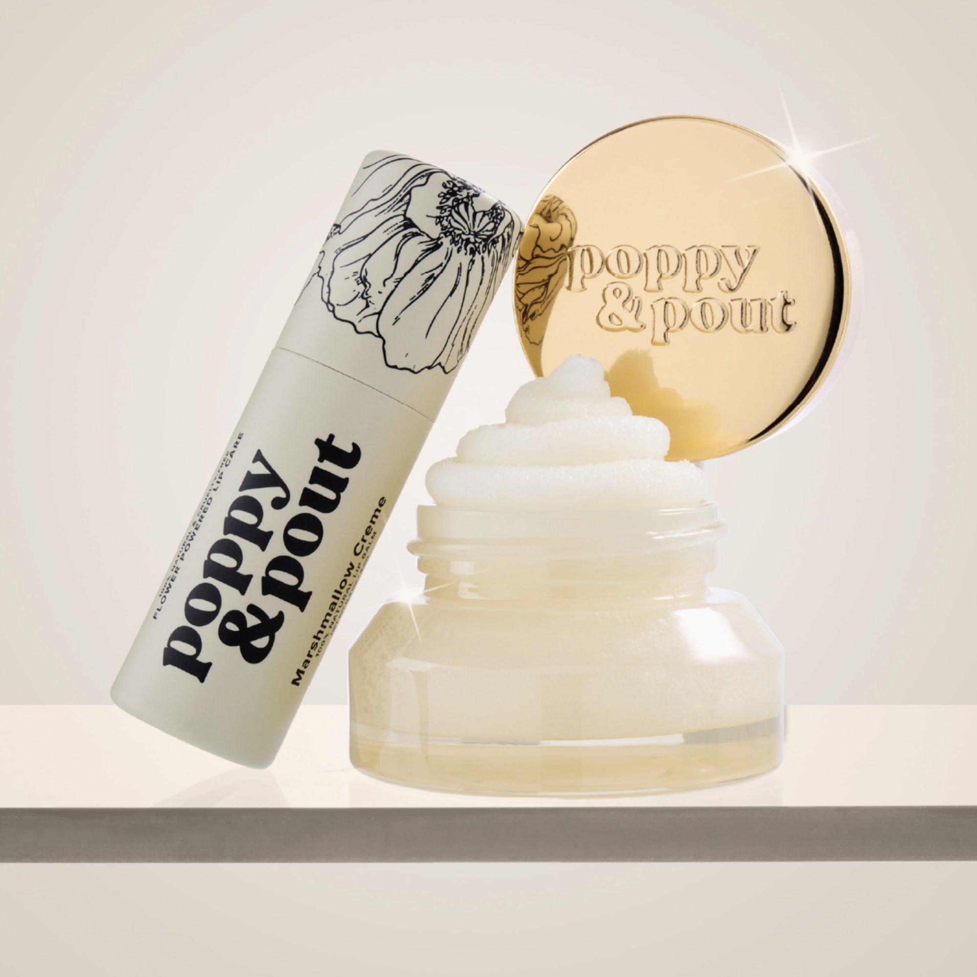 Marshmallow cream in a jar with a matching tube and gold lid