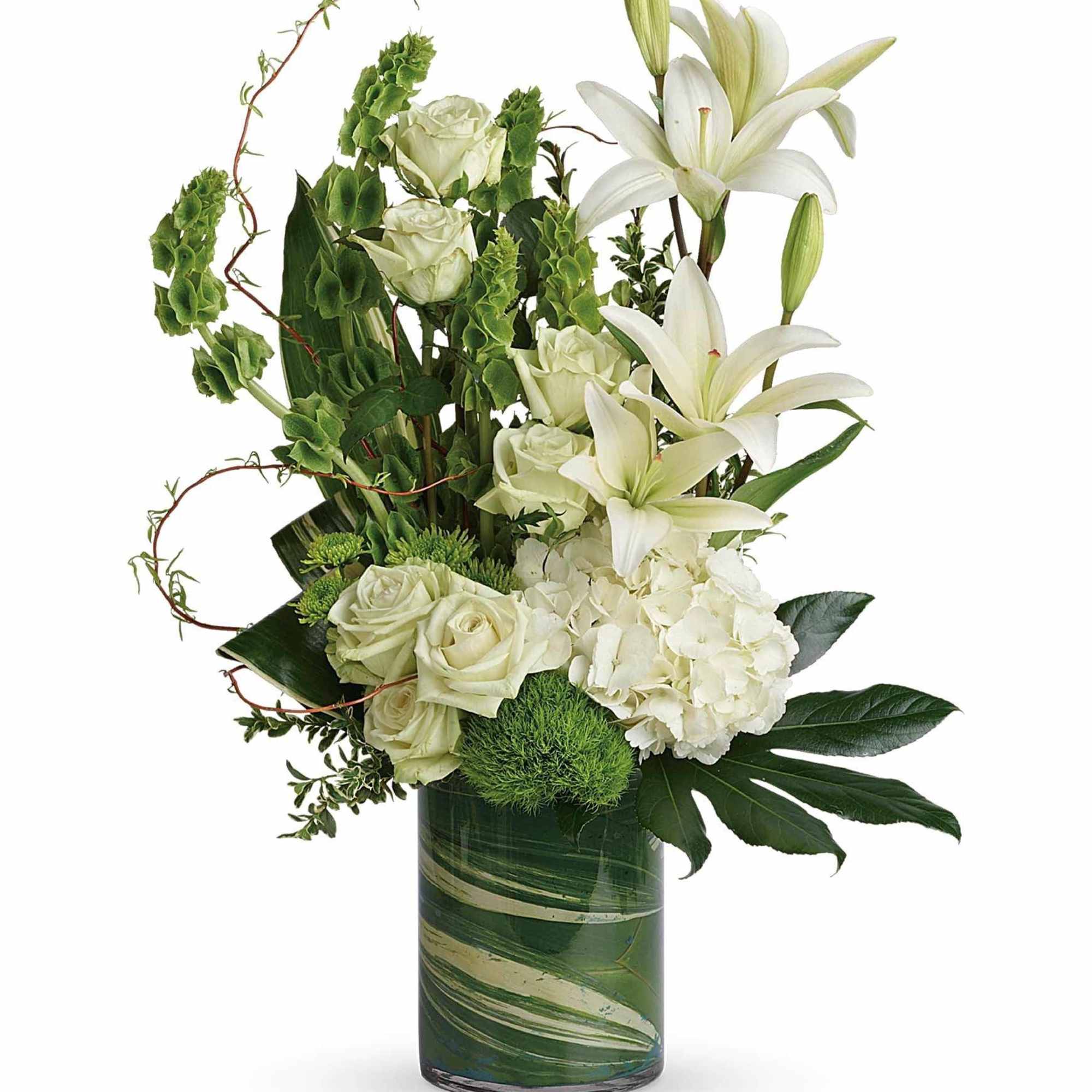 White roses and lilies in a green glass vase