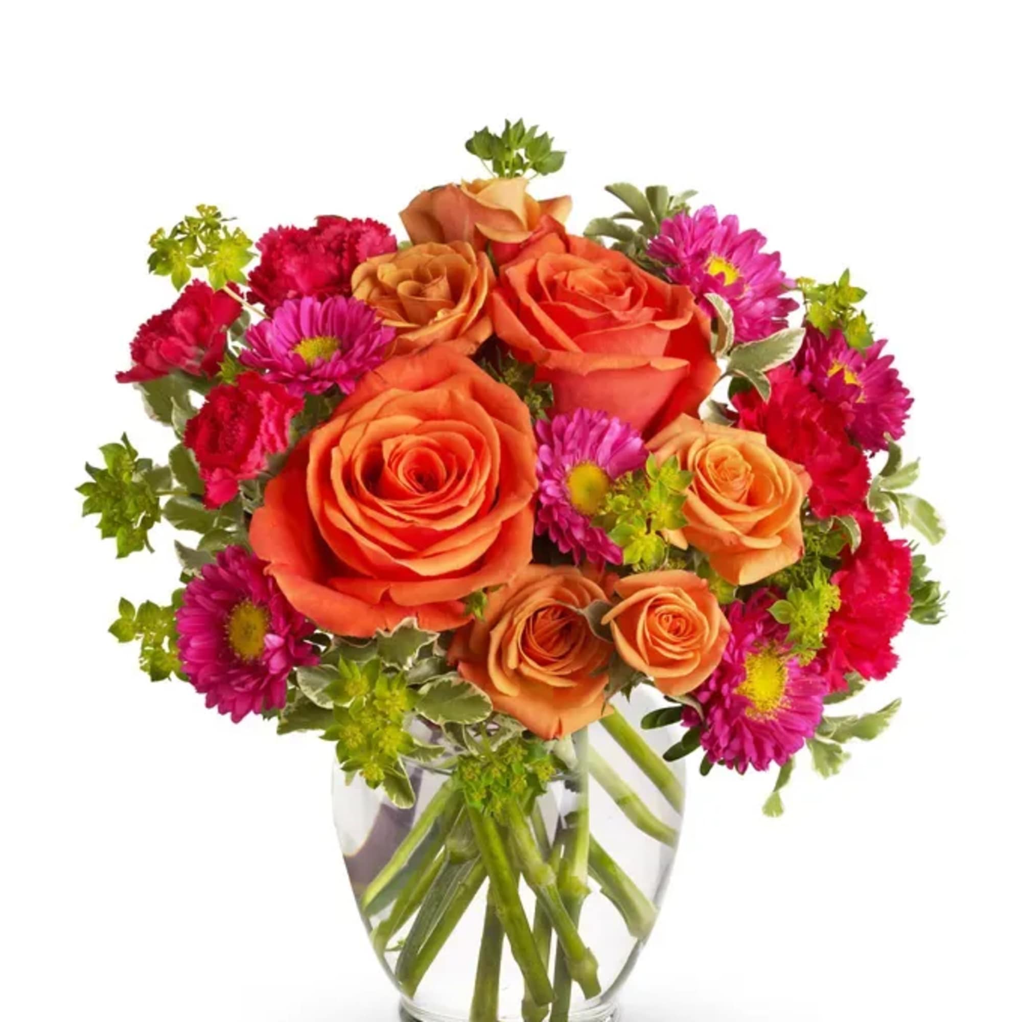 Orange roses and pink daisies in a clear glass vase