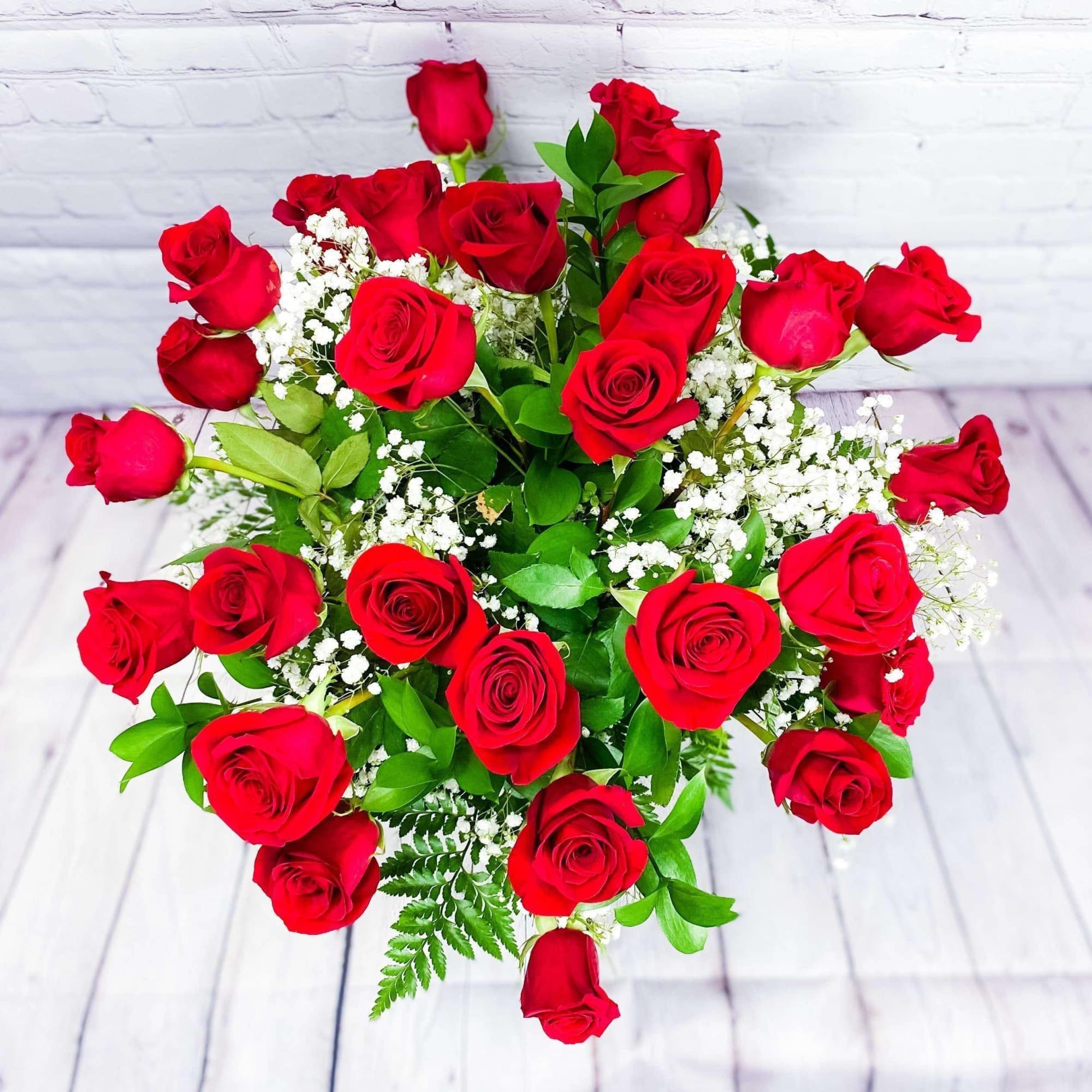 Experience the timeless elegance and romance of our Traditional Red Roses. These