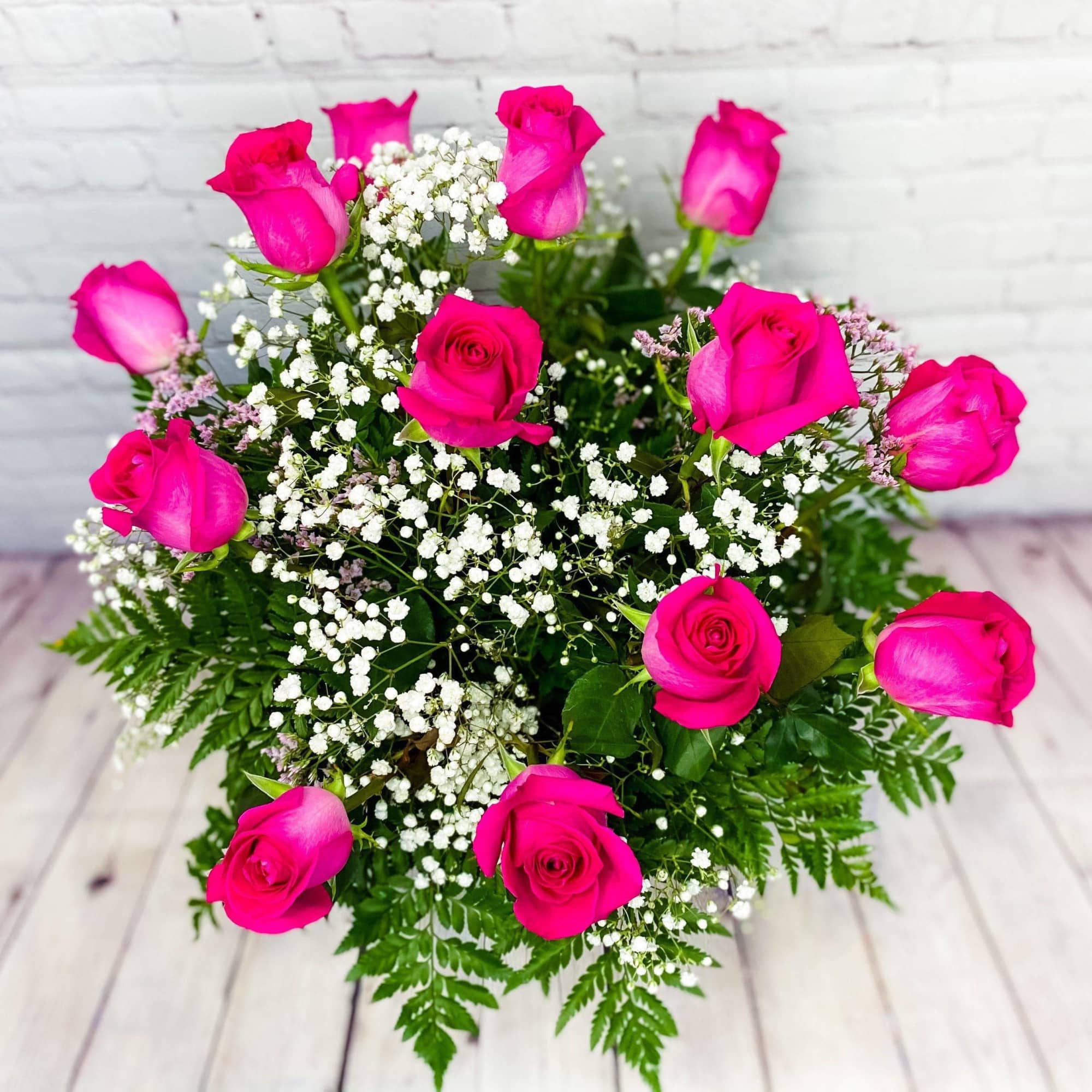 Bouquet of hot pink roses with white baby's breath