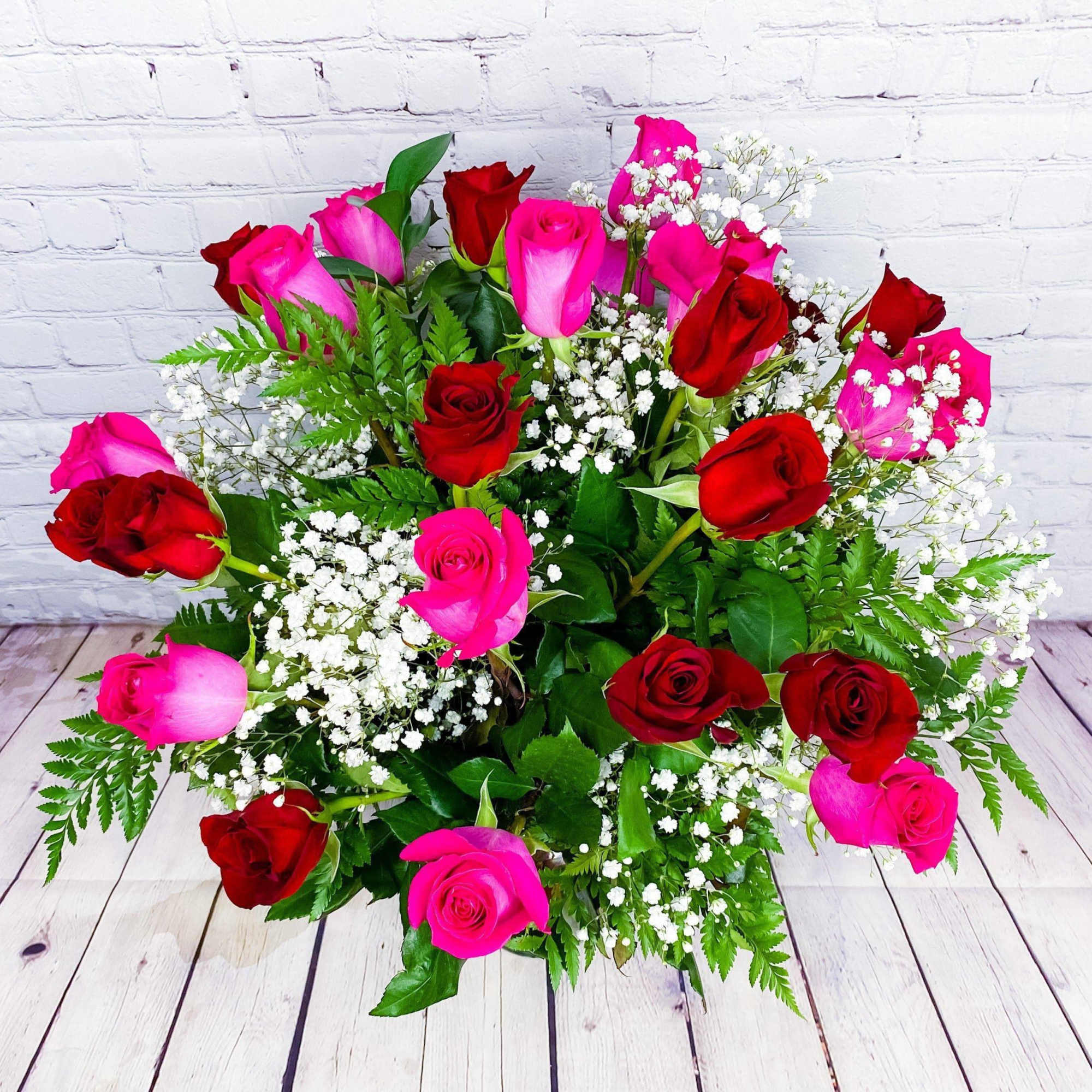 Bouquet of red and pink roses with white baby's breath