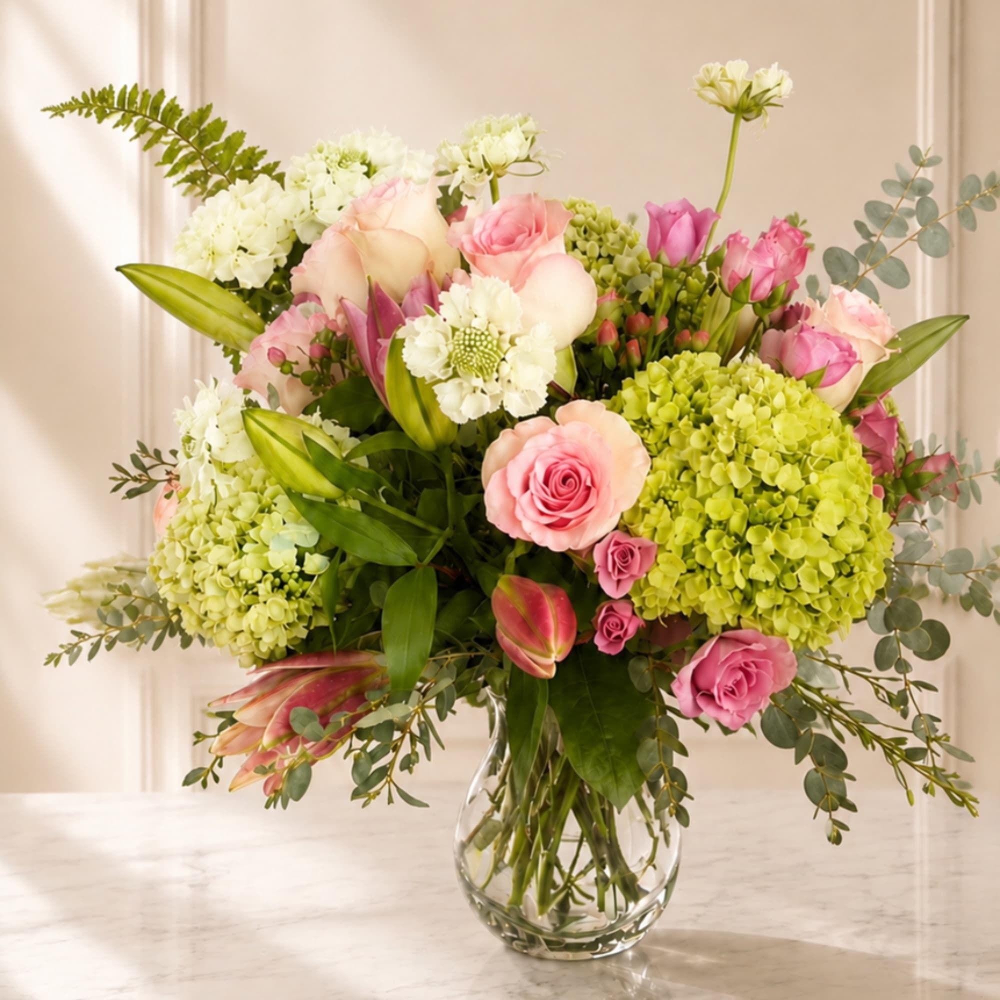 Pink and white mixed bouquet in a clear glass vase