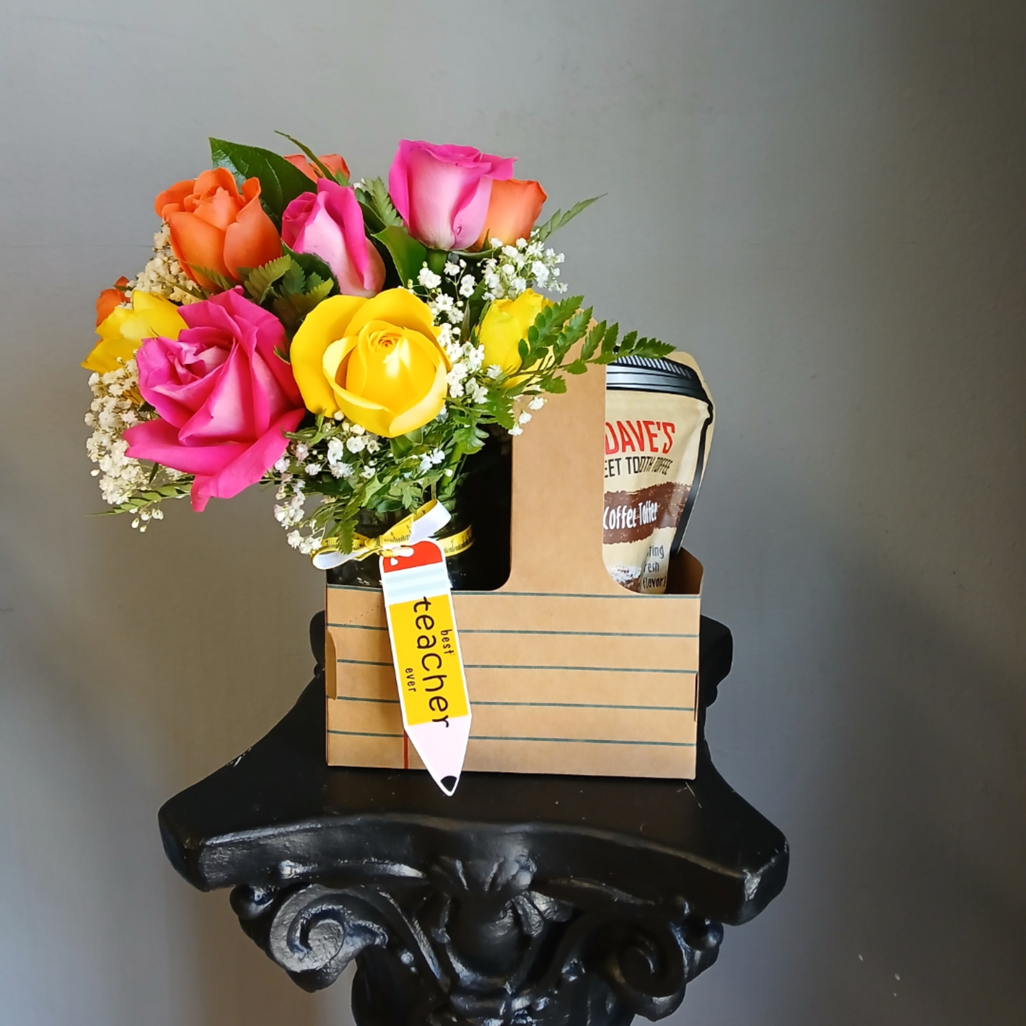 Colorful roses in a gift box with a teacher tag and coffee packet