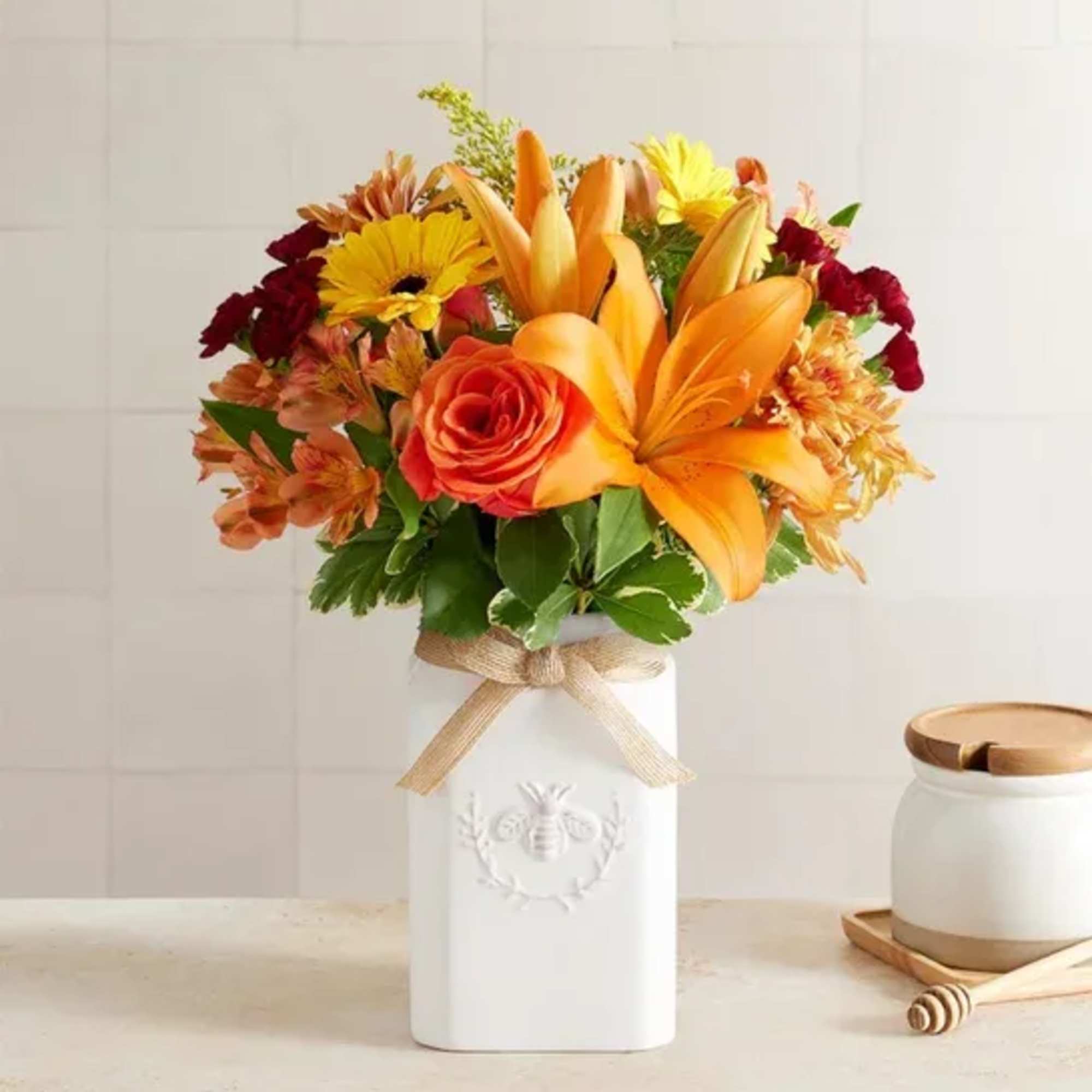 Get them buzzing for fall! Our unique, stylized bouquet is gathered with