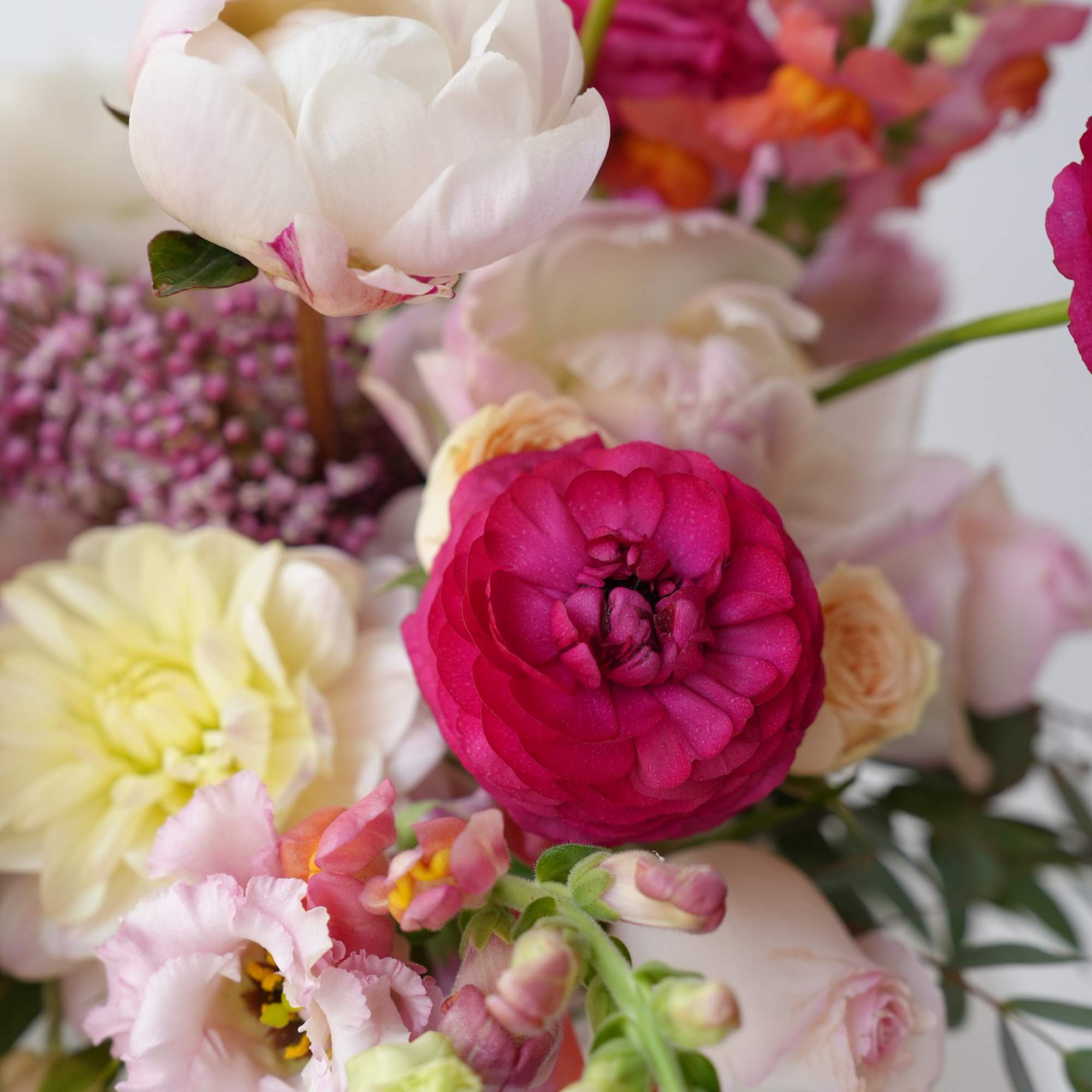 Mixed bouquet with pink, white, and yellow blooms