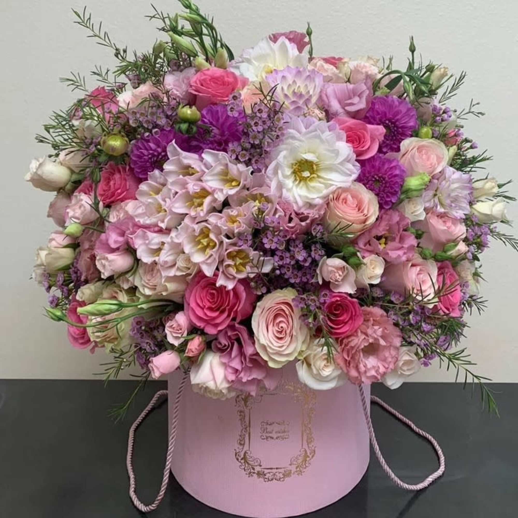 Pink and white mixed bouquet in a round pink box