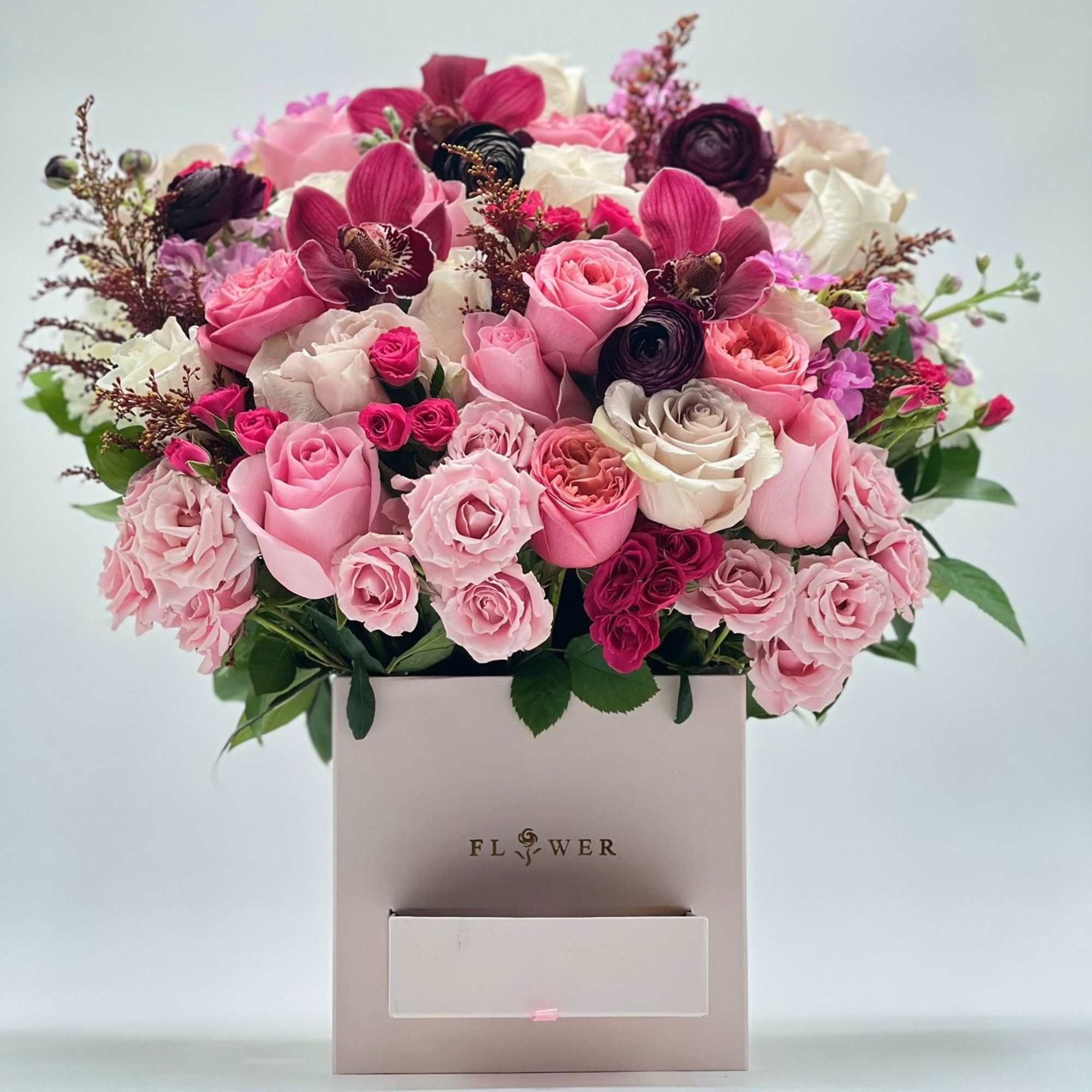 Pink and white rose bouquet in a square gift box