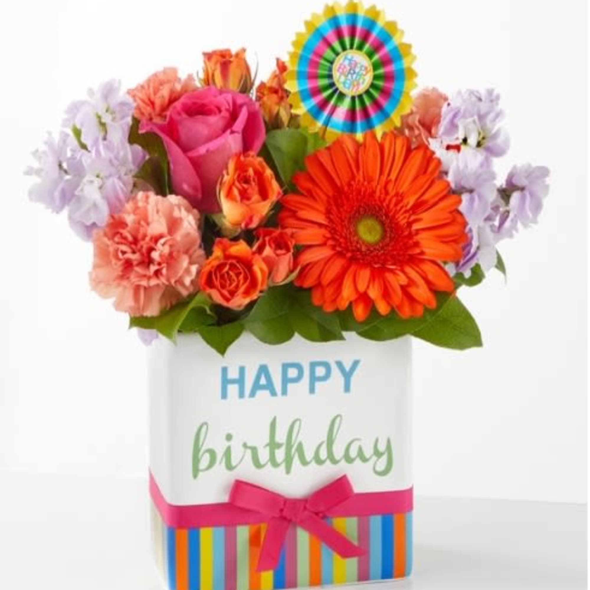 Birthday flower arrangement in a striped gift box with a ribbon