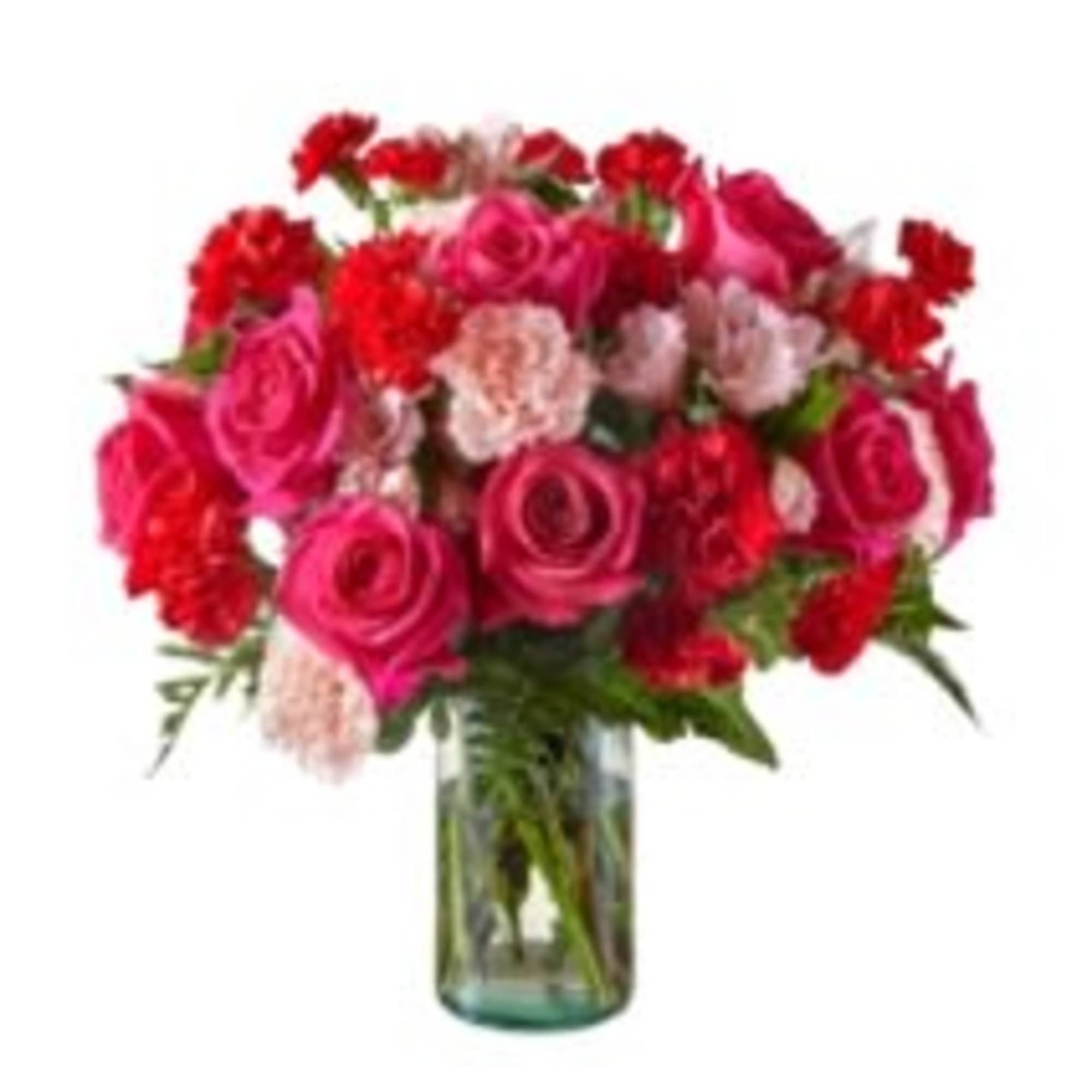 Bouquet of pink and red roses with carnations in a glass vase
