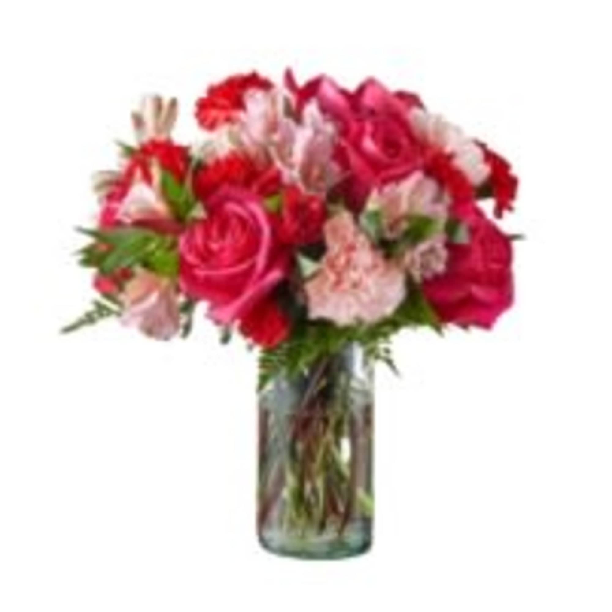 Bouquet of pink and red flowers in a clear glass vase