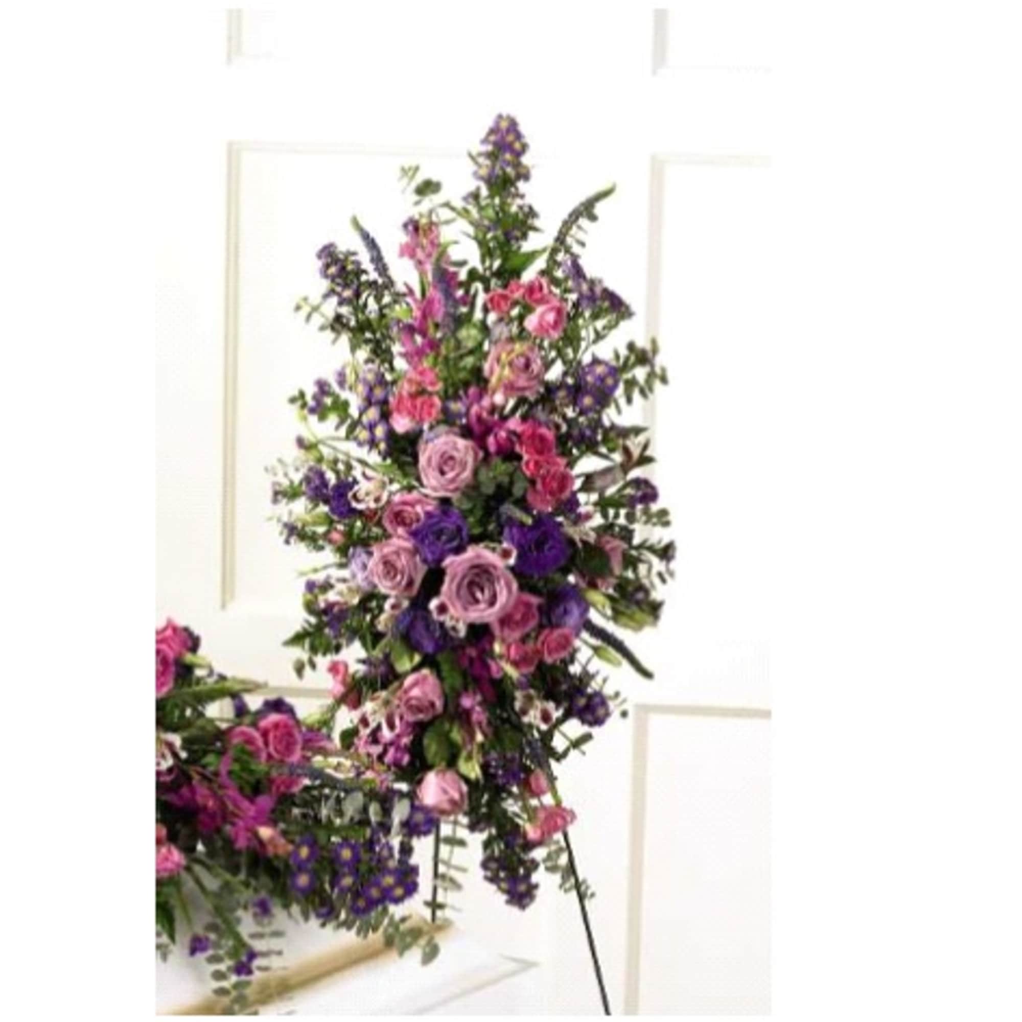Tall standing floral spray with pink and purple roses