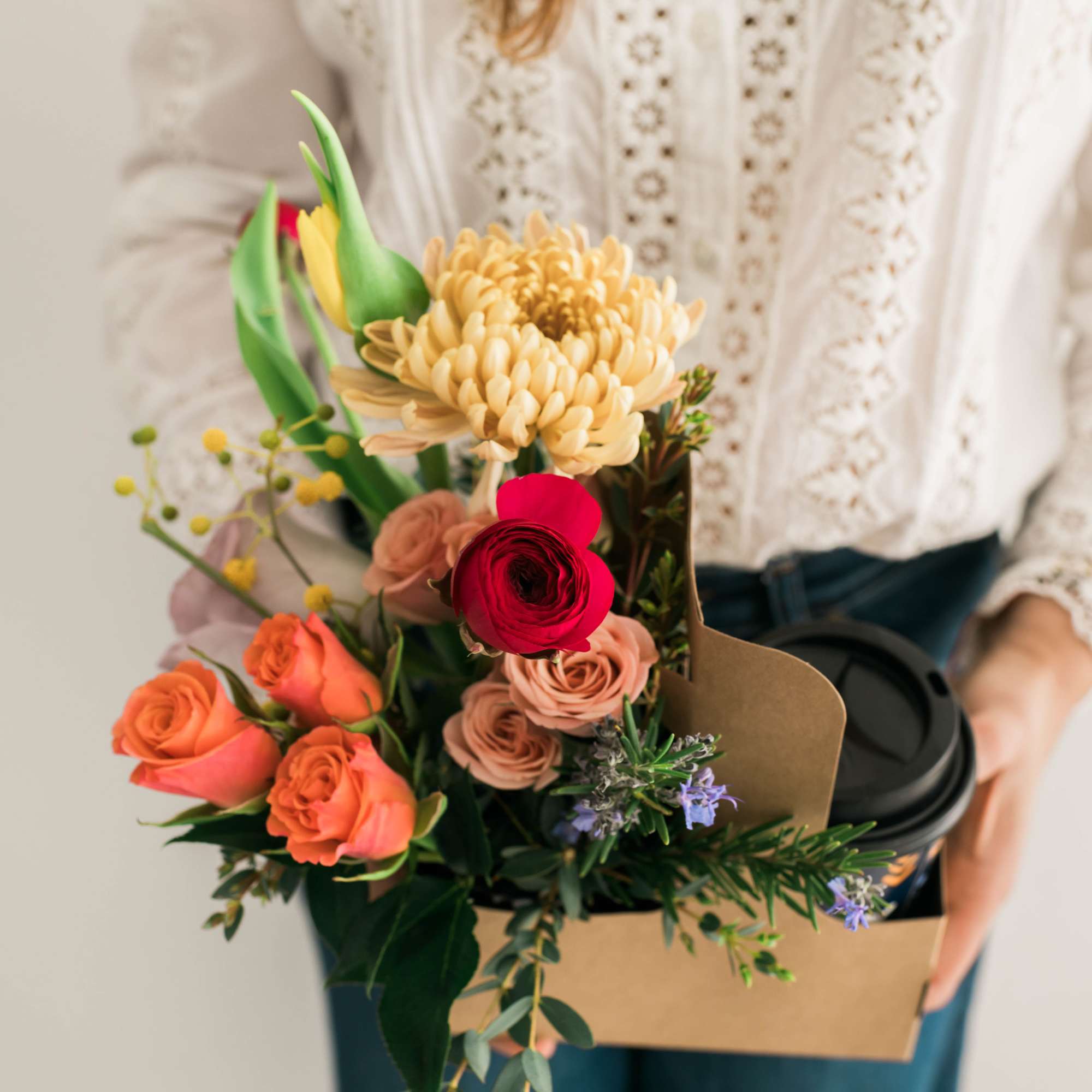 Handheld bouquet with roses, chrysanthemum, and mixed blooms in a box