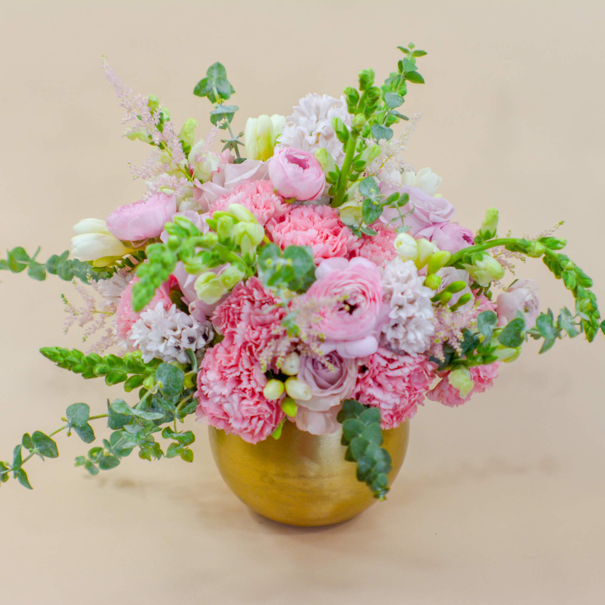 Pink and white floral arrangement in a gold vase, photo 4 of 5
