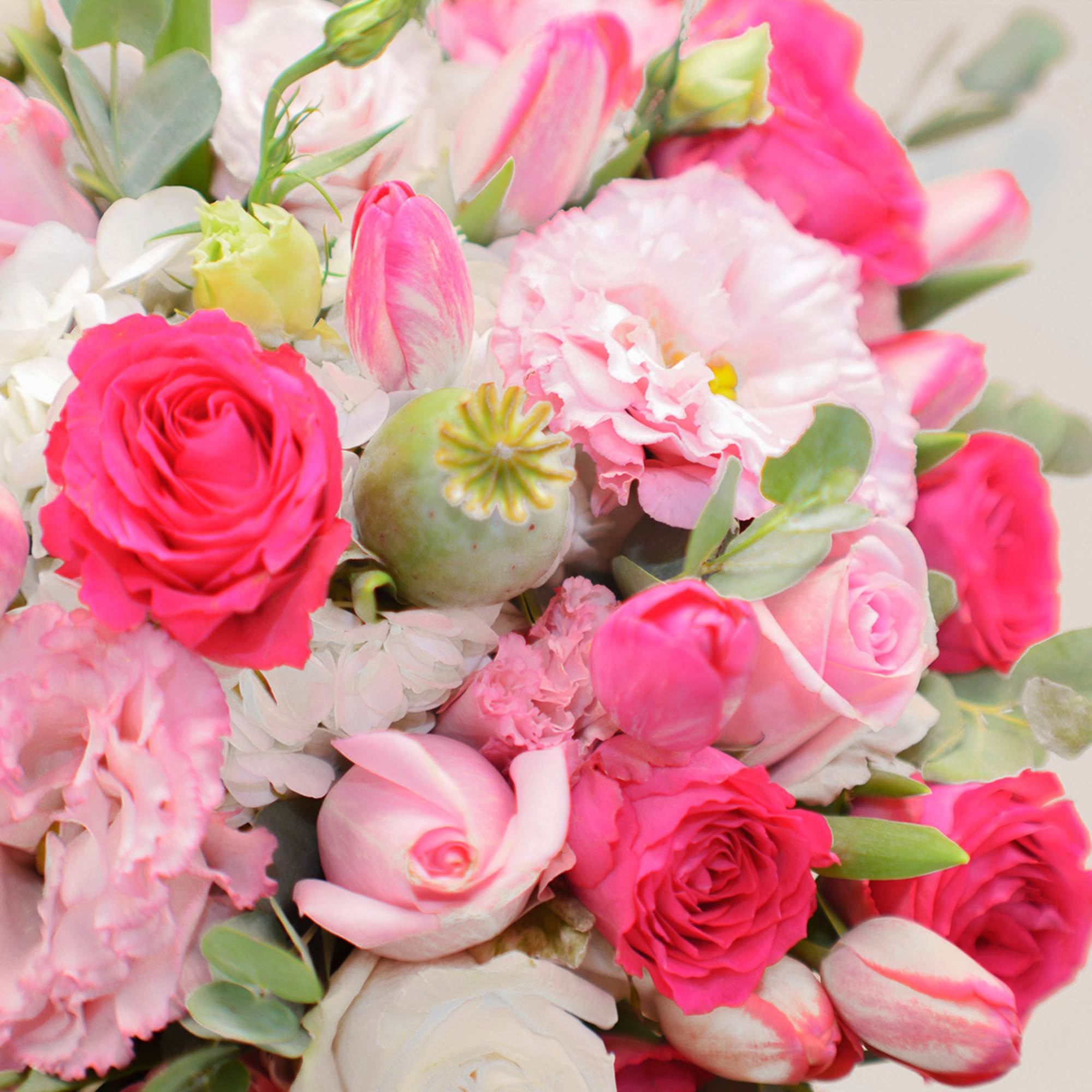 Bouquet of pink and white roses, tulips, and carnations