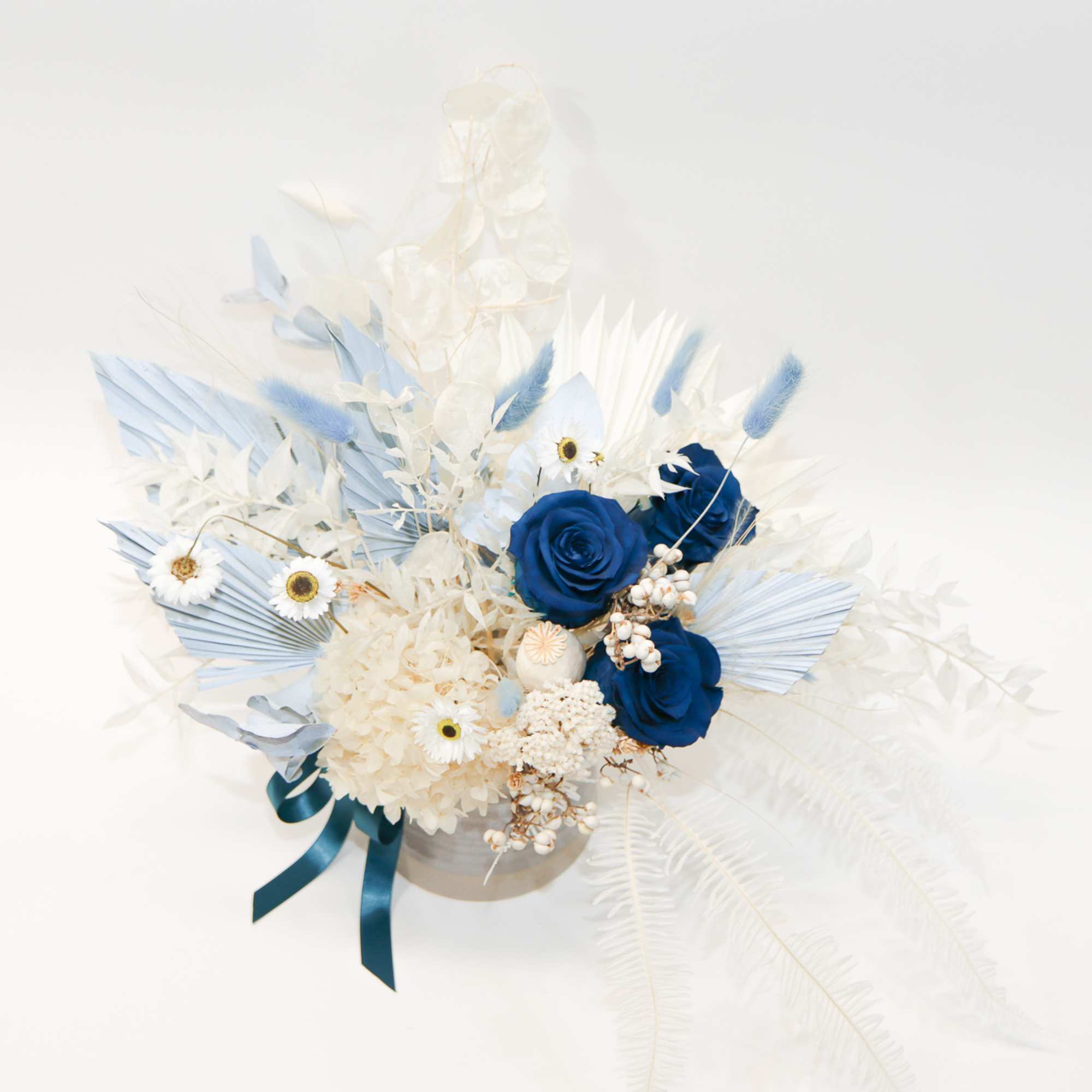Blue and white floral arrangement in a round container with ribbon, photo 4 of 4