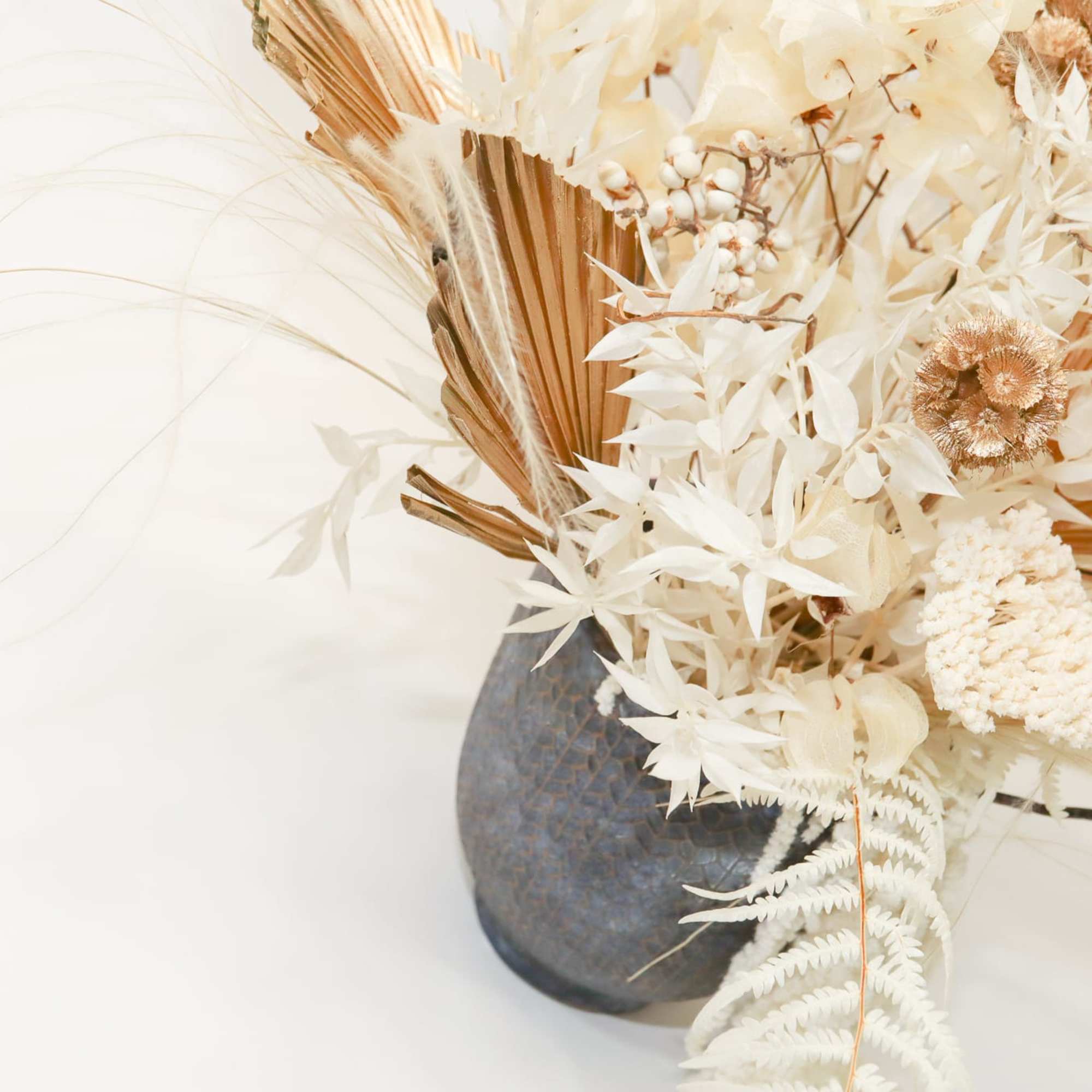 Cream dried floral arrangement in a dark vase, photo 3 of 4