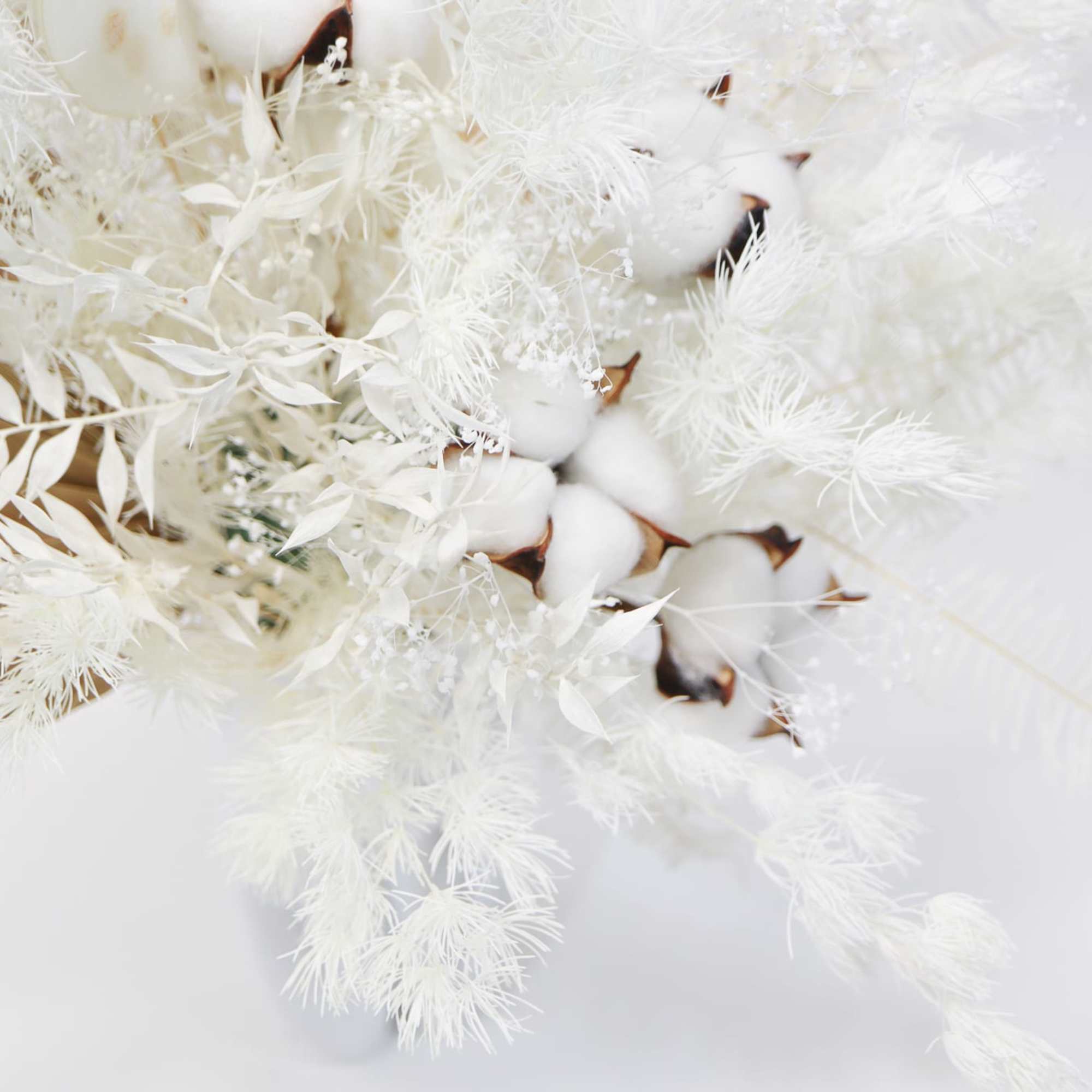 White dried bouquet with cotton bolls and feathery stems