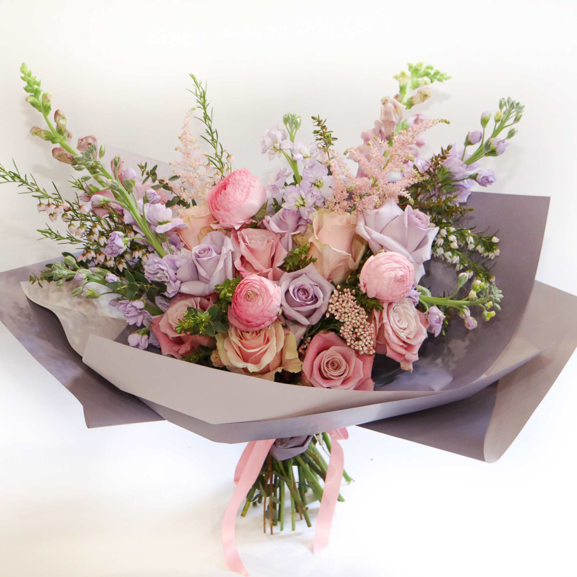 Bouquet of pink and lavender roses with pastel filler flowers, photo 4 of 4