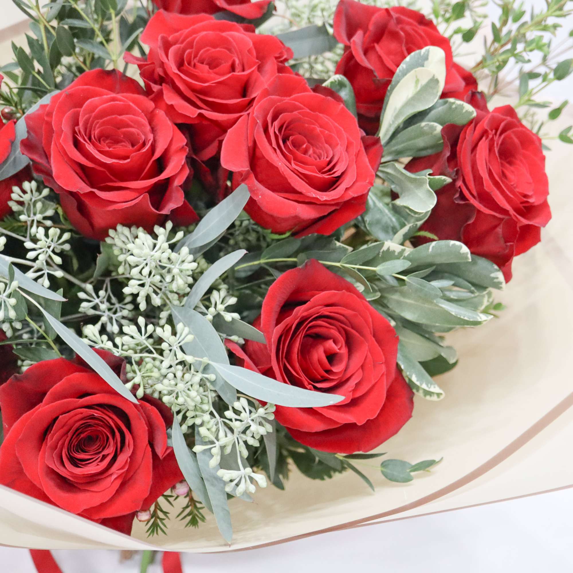 One dozen red roses in a hand tied bouquet! Do not come