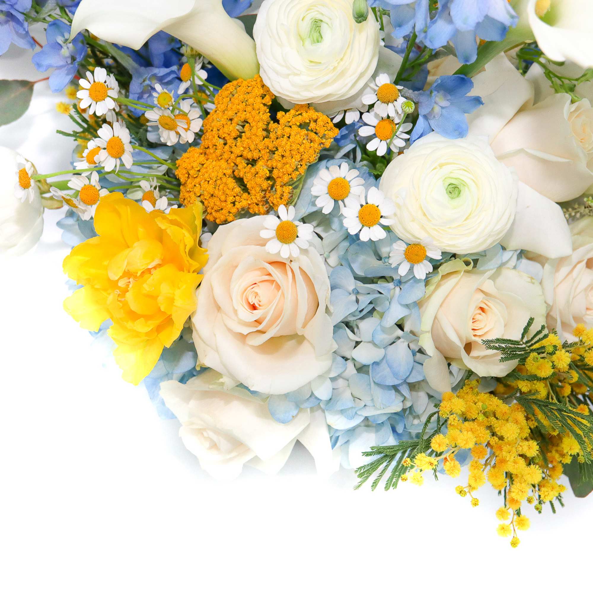 Mixed bouquet of white roses, yellow blooms, and blue flowers