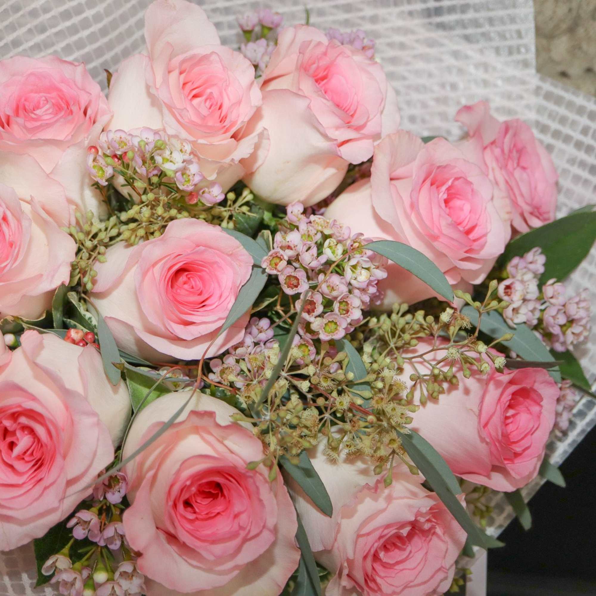 A classic one dozen pink roses with pink/white wax flowers., photo 2 of 3