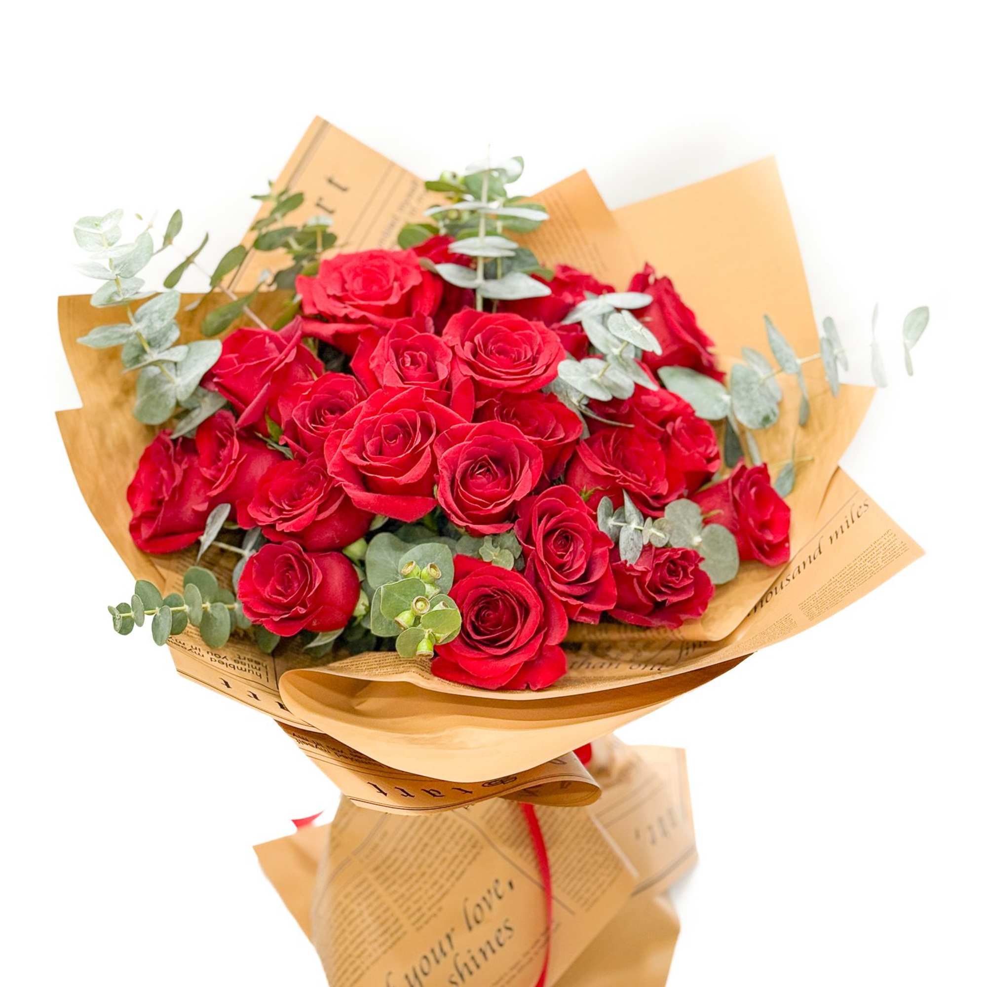 Bouquet of red roses wrapped in tan paper with eucalyptus, photo 2 of 4