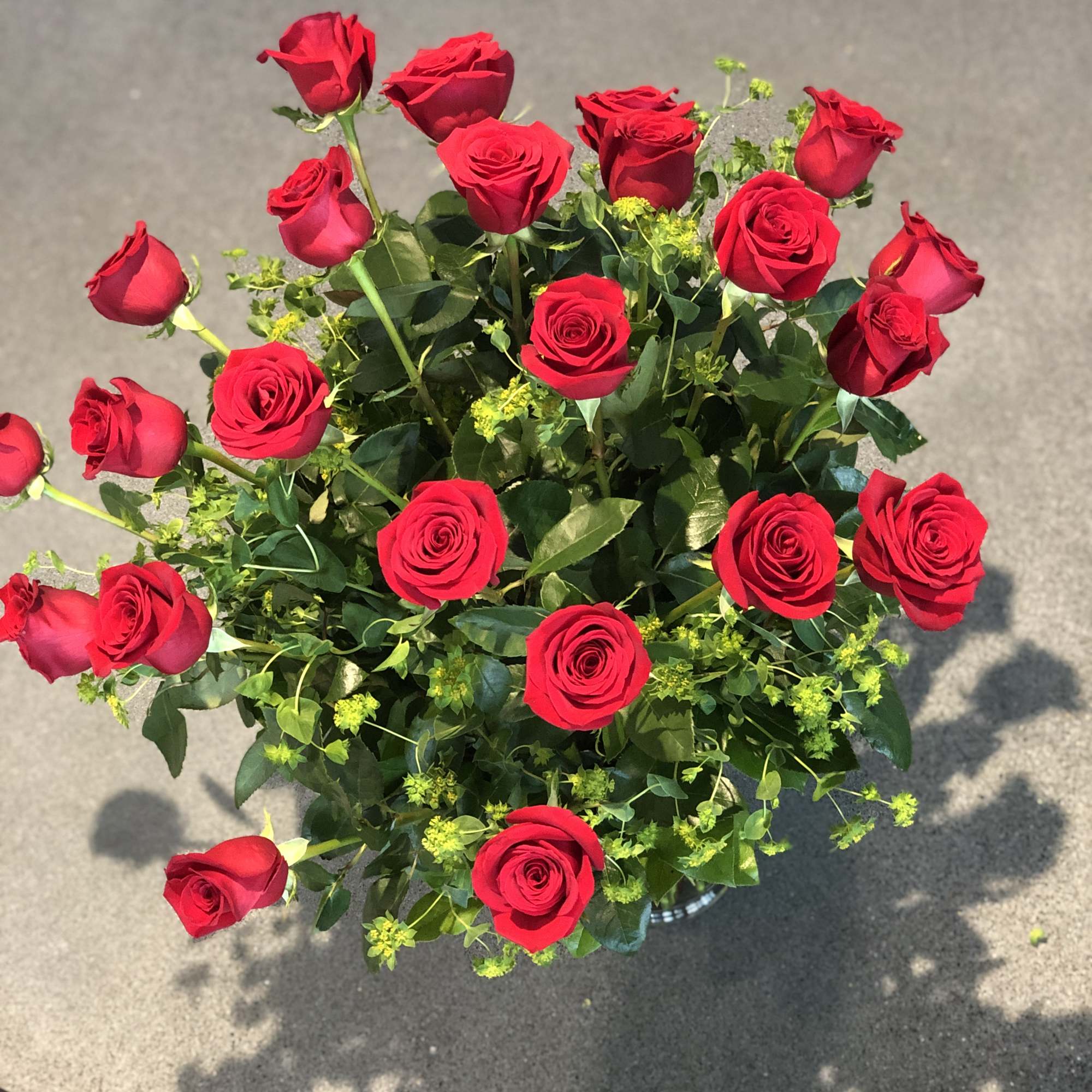 Bouquet of red roses with green filler