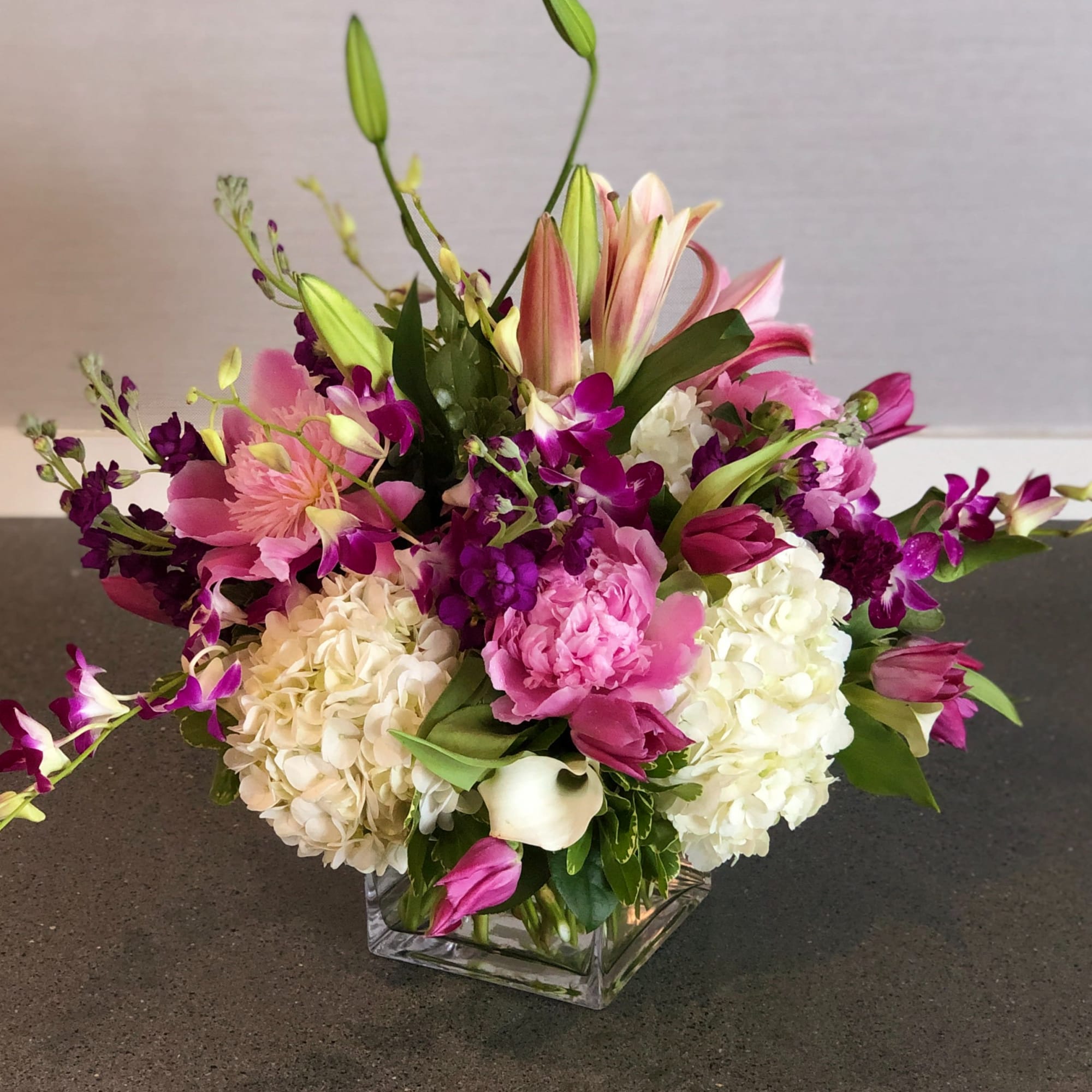 Pink and white floral arrangement in a square glass vase, photo 3 of 3