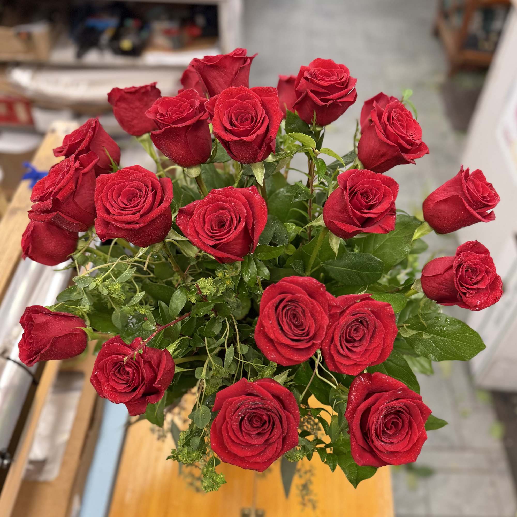 Bouquet of red roses with greenery