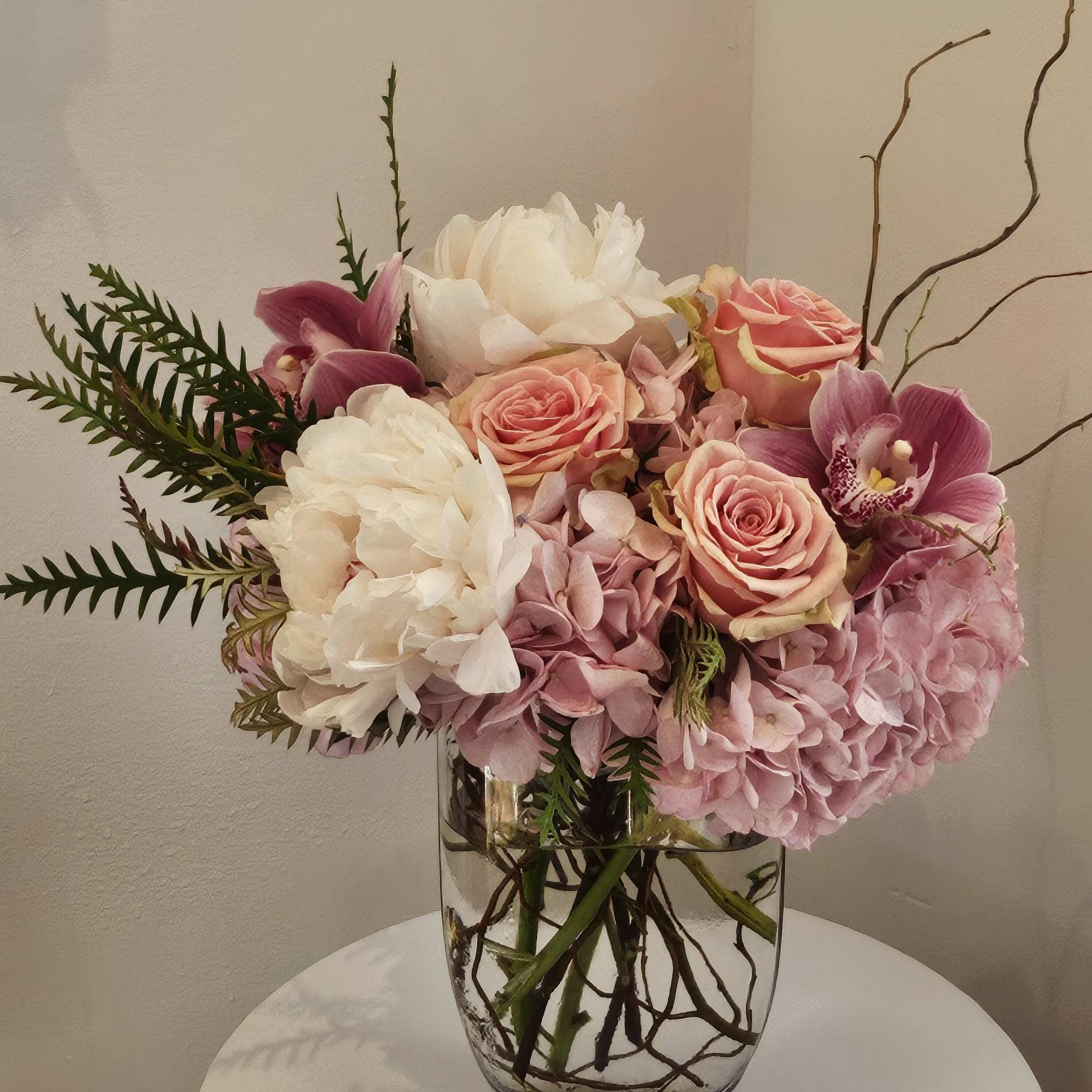 Pink and white floral arrangement in a clear glass vase, photo 4 of 4