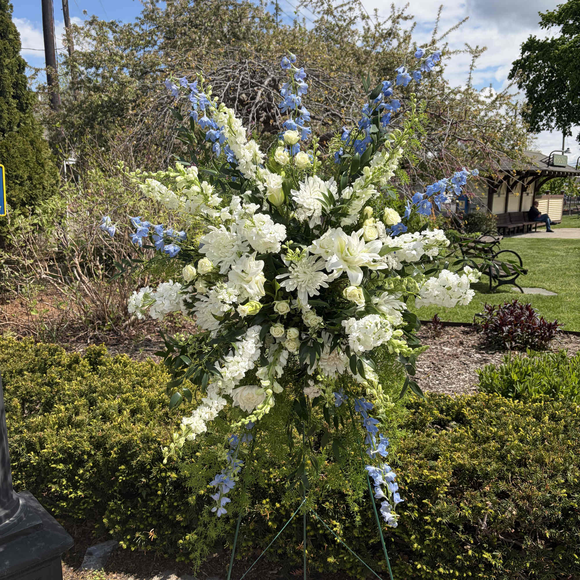 A towering sympathy standing spray that speaks of calm and comfort, Double