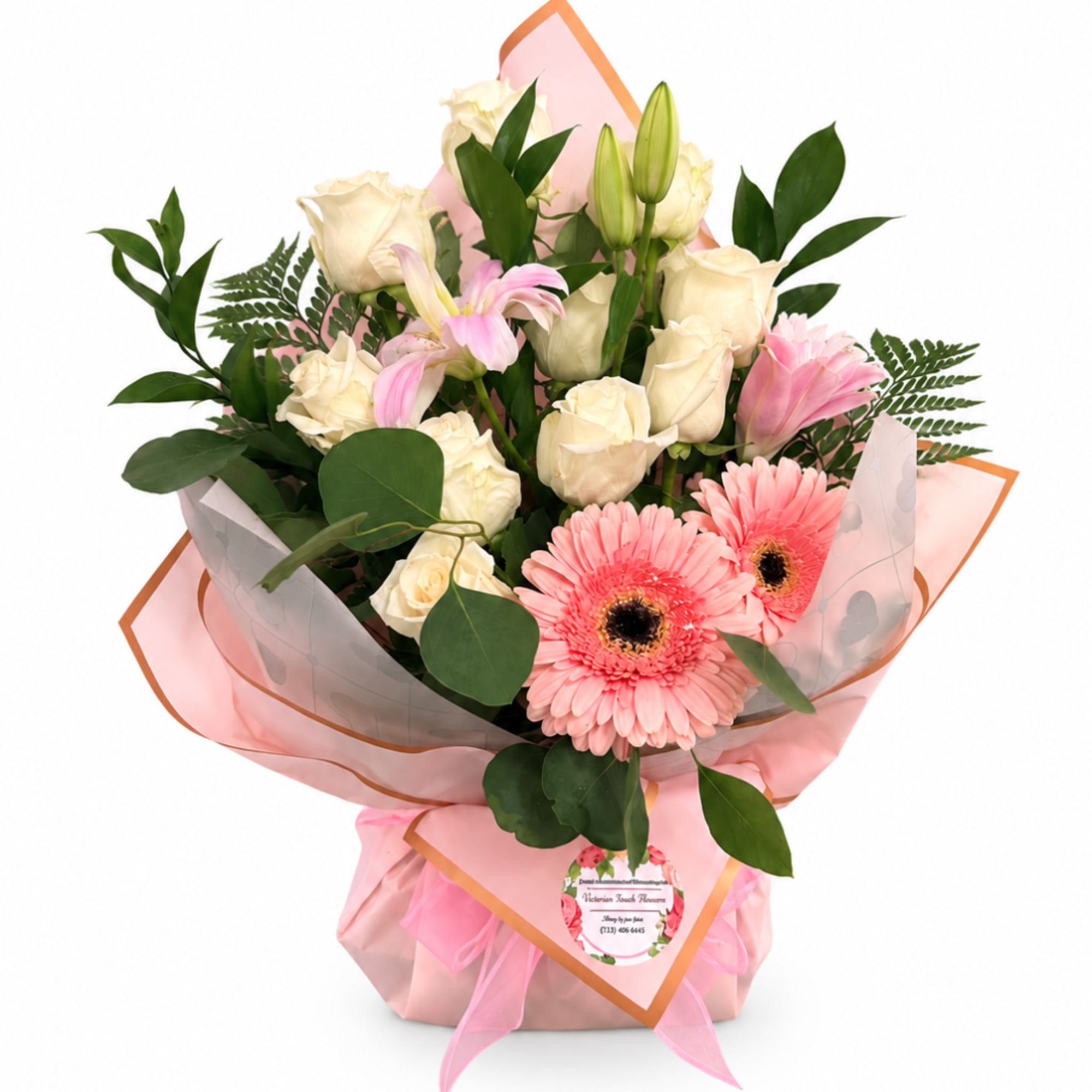 Pink and cream bouquet with roses, lilies, and gerbera daisies in pink wrap