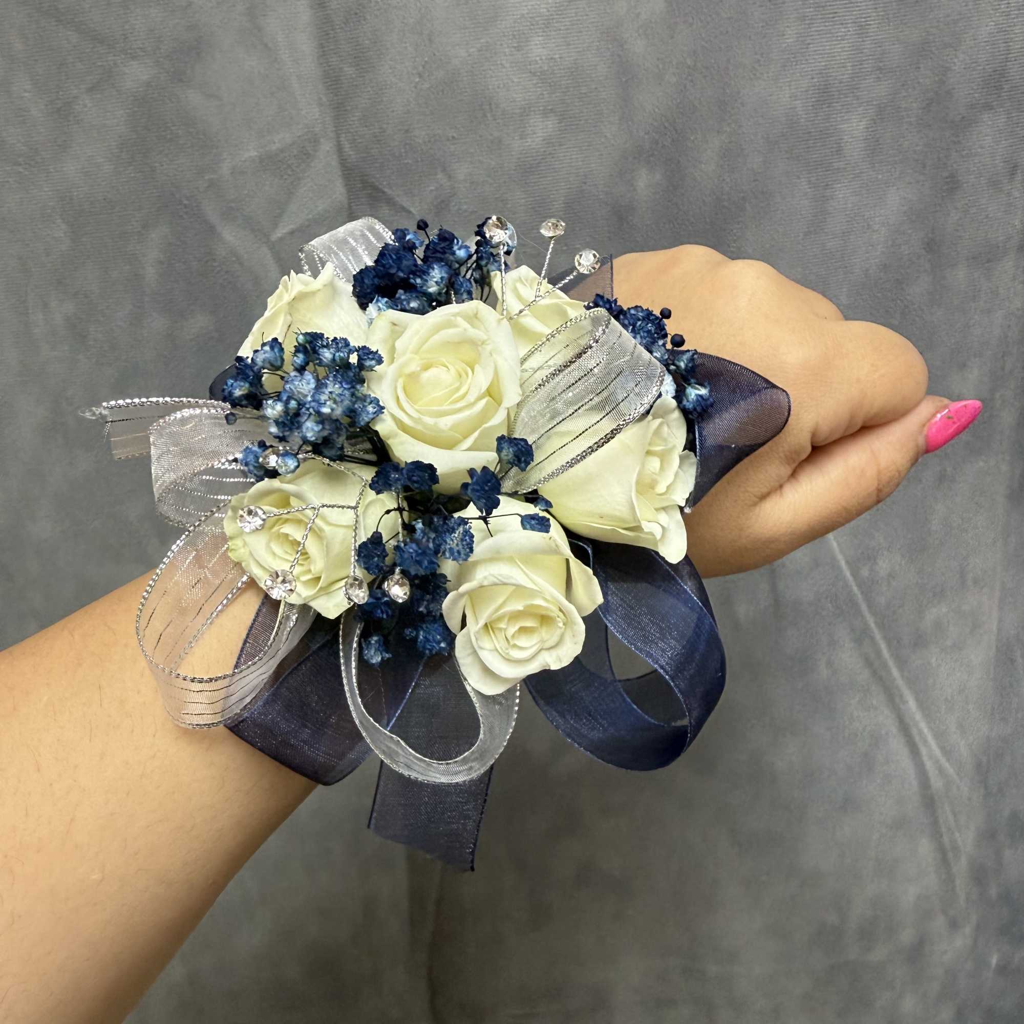 White spray roses with navy &amp; baby blue fillers with pearl bracelet