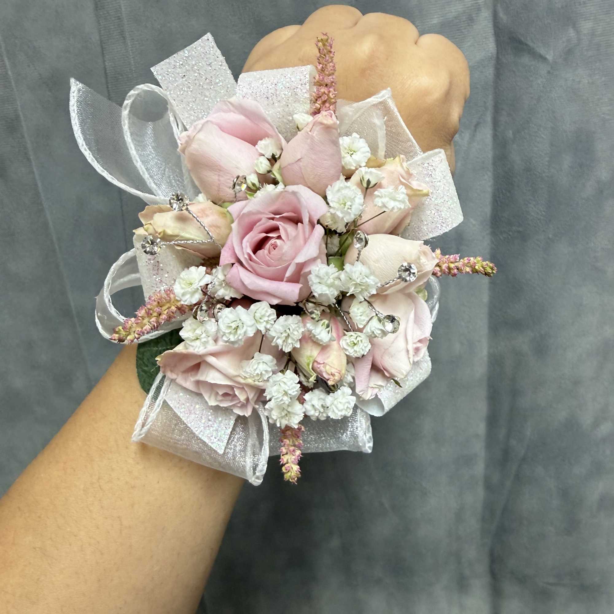pink spray roses with pink and white filler, sheer ribbons and rhinestone