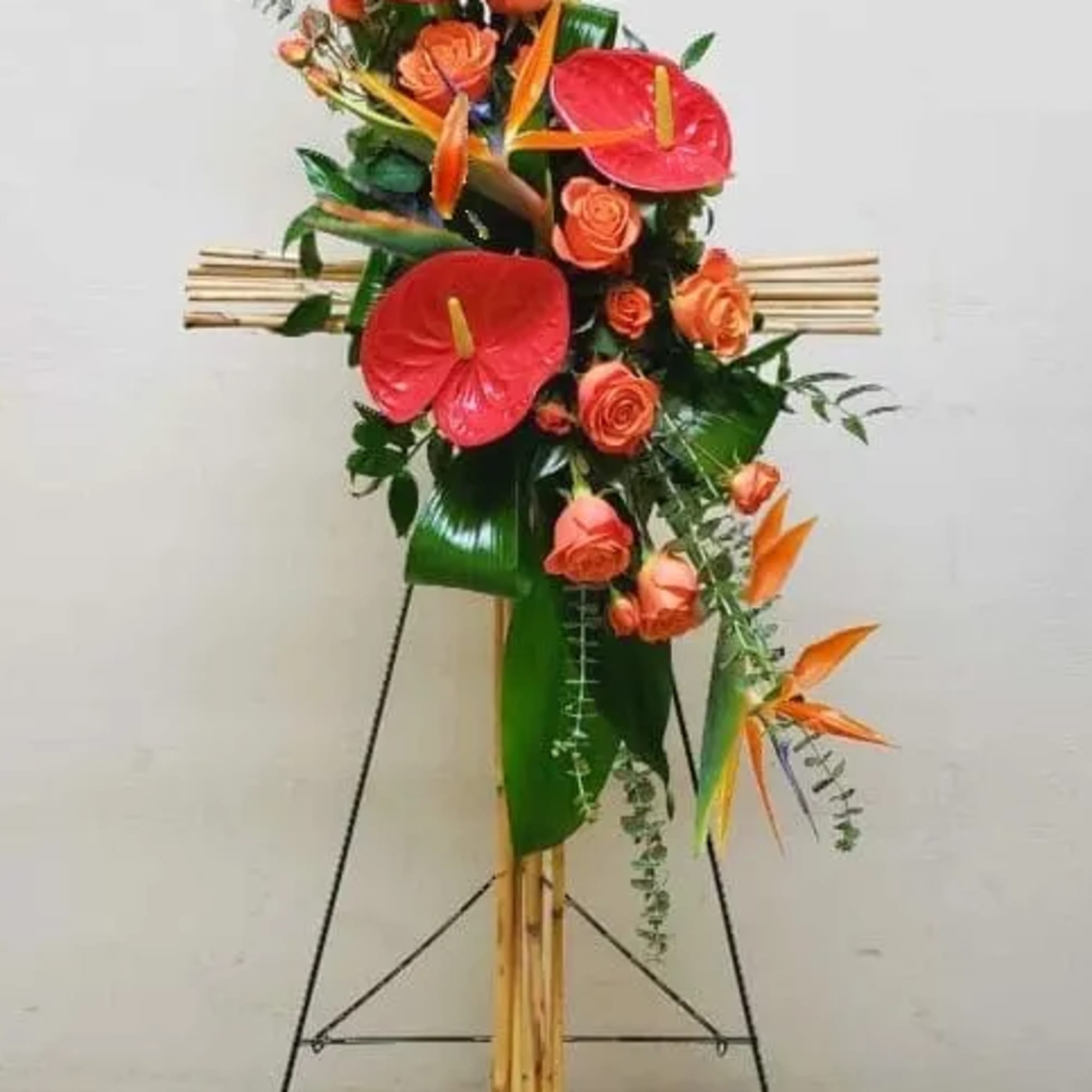 ARISE IN PARADISE RIVER CANE CROSS ON EASEL BY TWIN TOWERS FLORIST