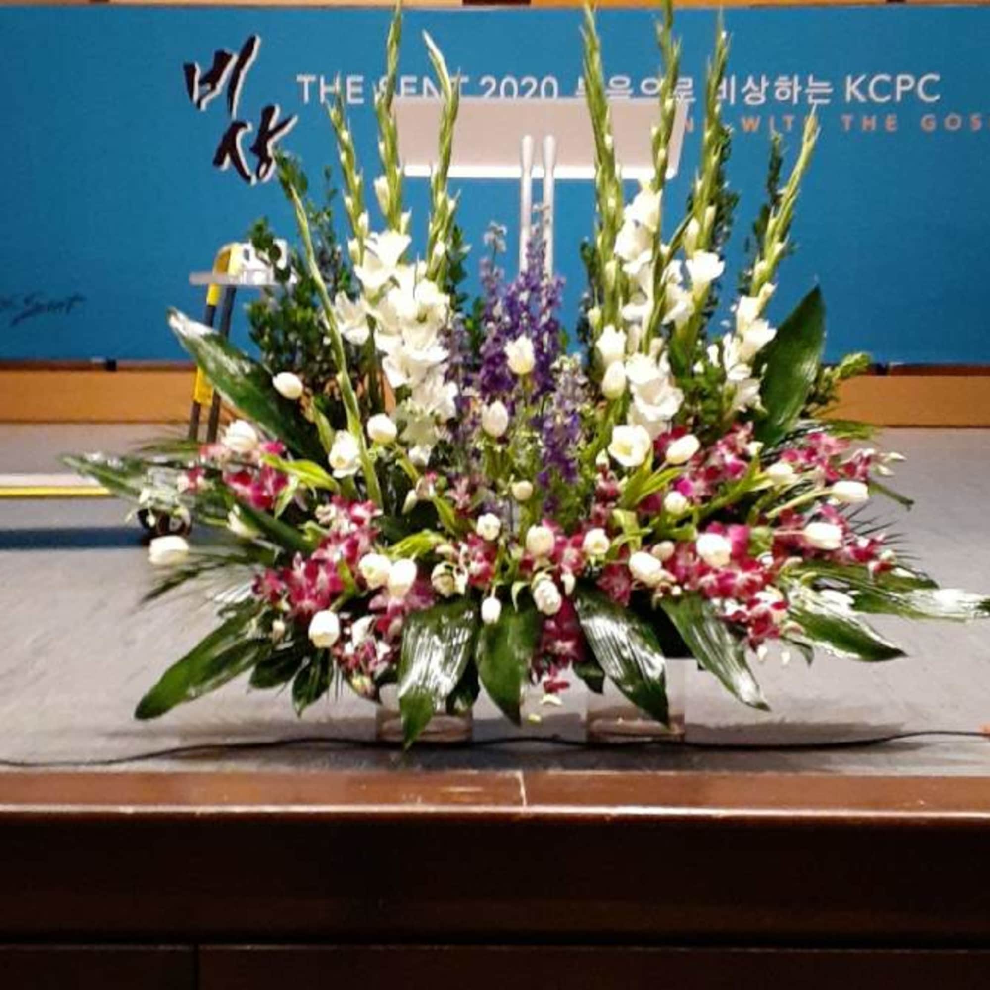 PODIUM ARRANGEMENT 139 BY TWIN TOWERS FLORIST, photo 2 of 2
