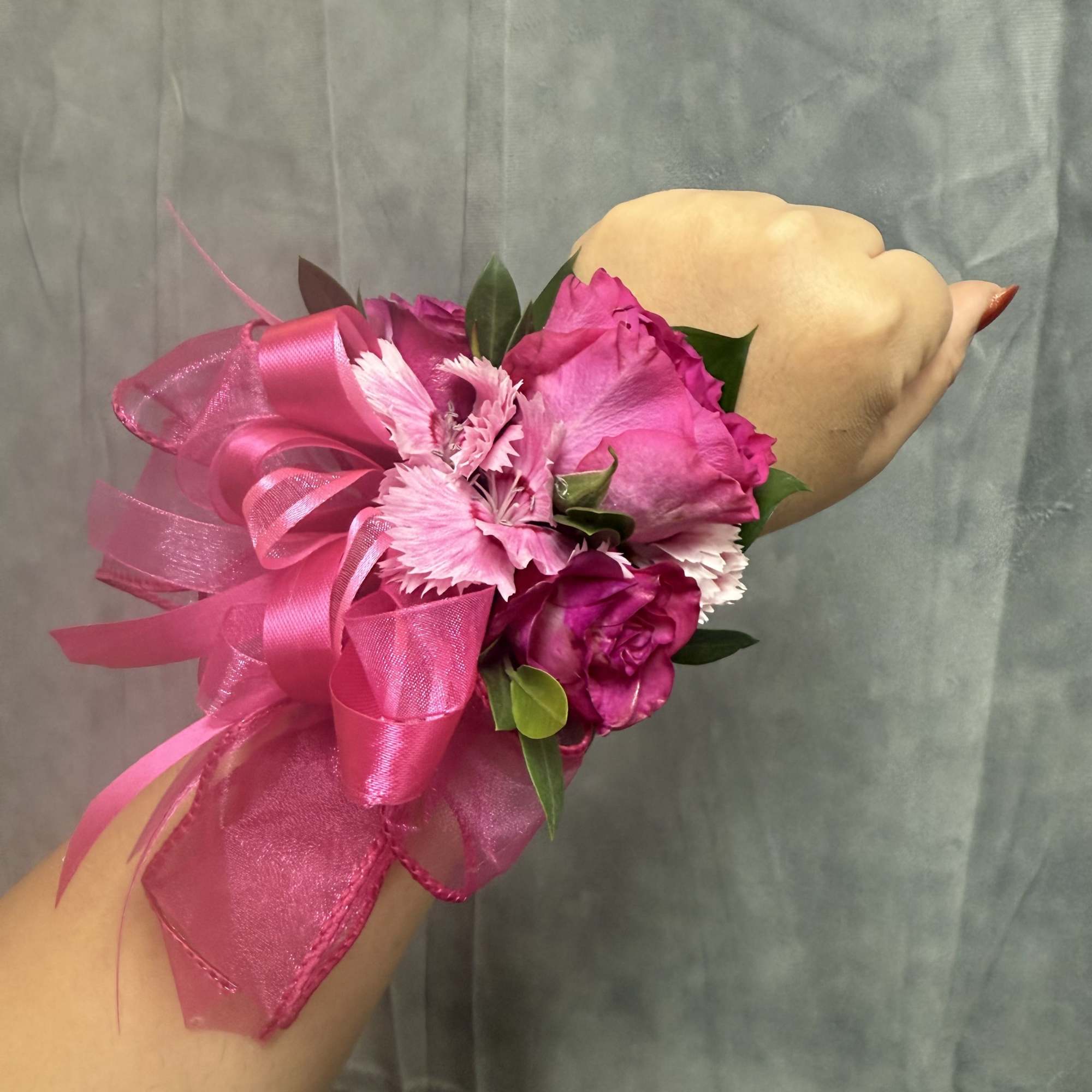 Bright hot-pink roses with pink carnations, accented with organza and a glossy, photo 2 of 2