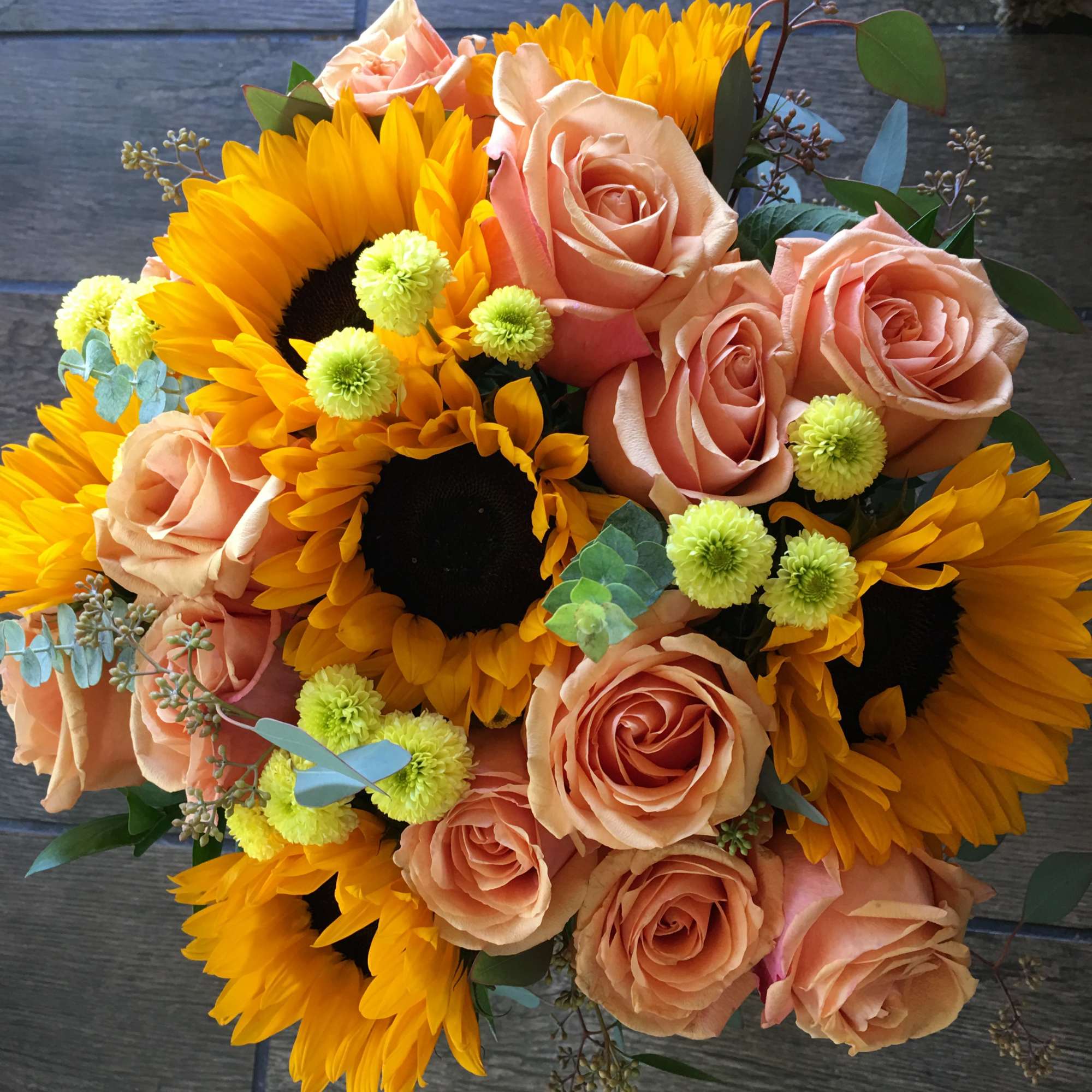 Hand tide bouquet May consist of peach roses sunflowers, yellow pompom, foliage, photo 2 of 2