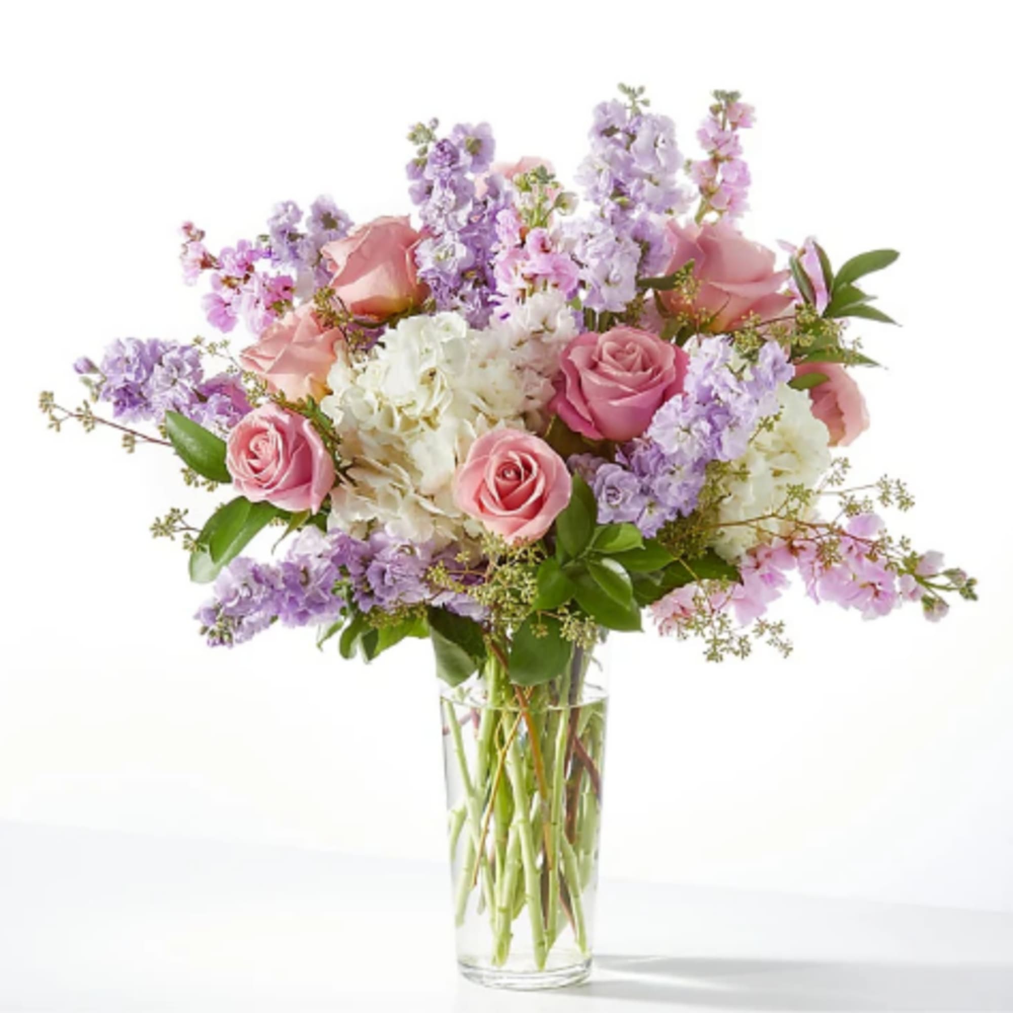 Pink and lavender bouquet in a clear glass vase