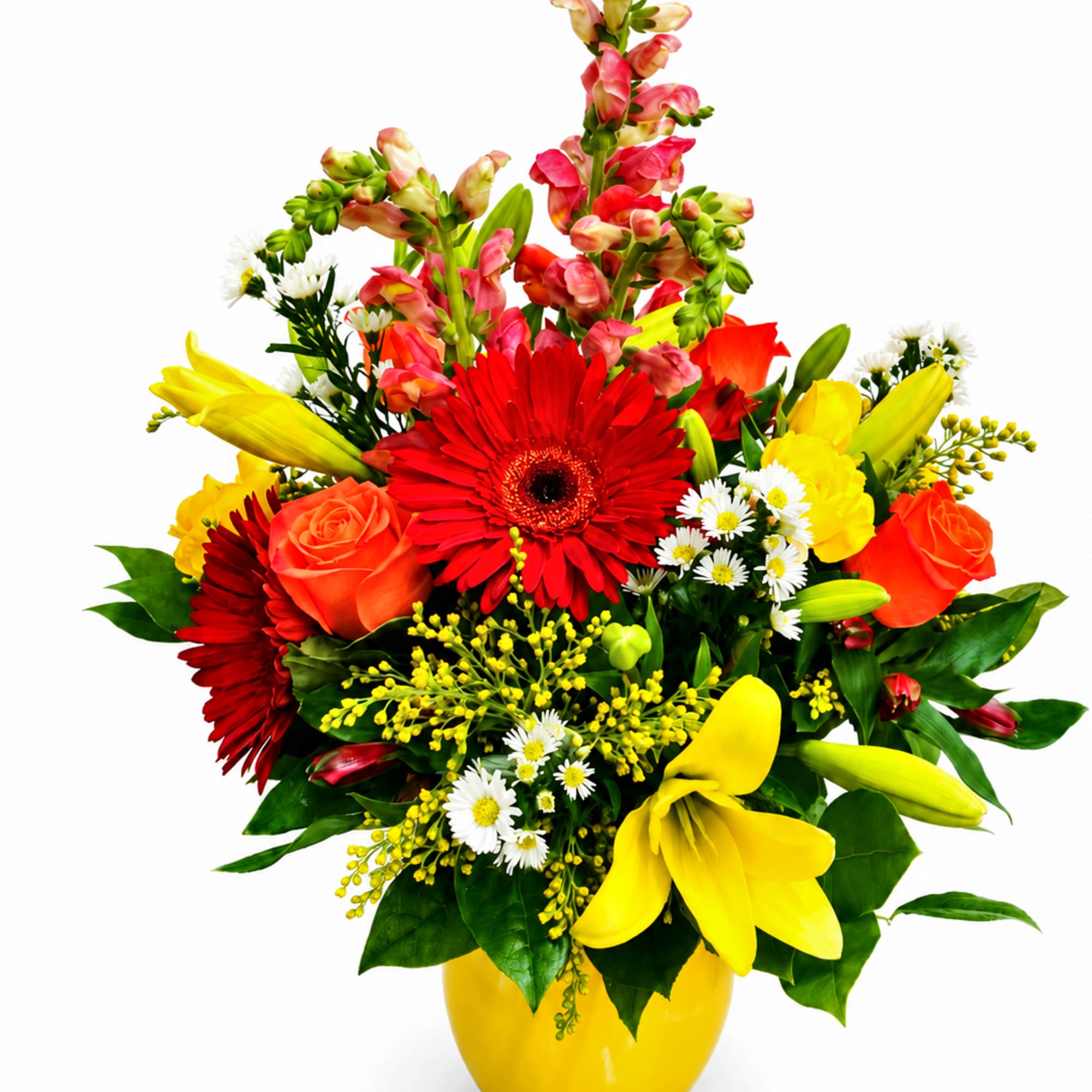 Bright mixed bouquet in a yellow vase with red, yellow, and orange flowers
